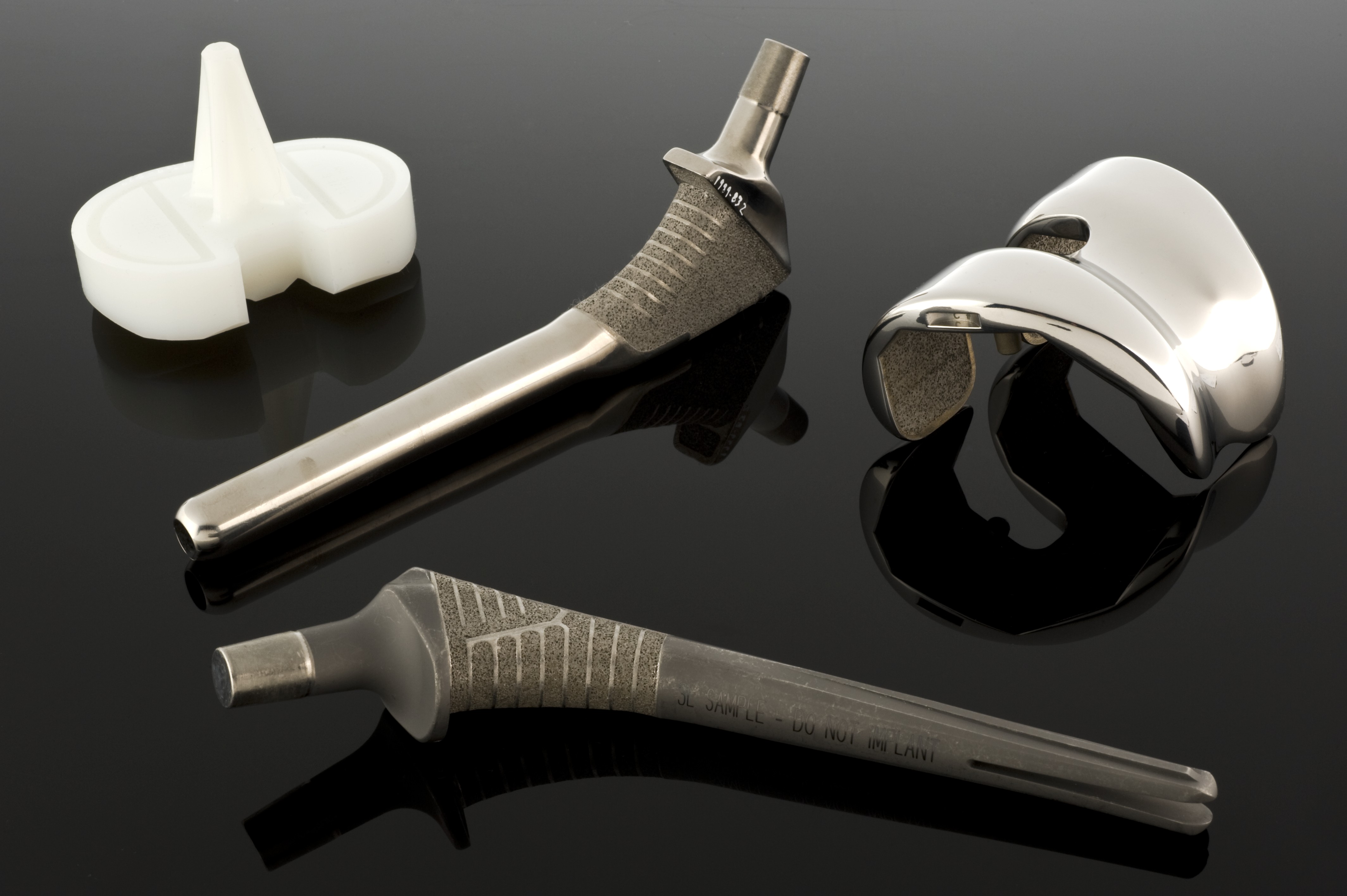A medical hip joint implant. In biomedical engineering, material availability and strict biocompatibility act as non-negotiable design constraints.
