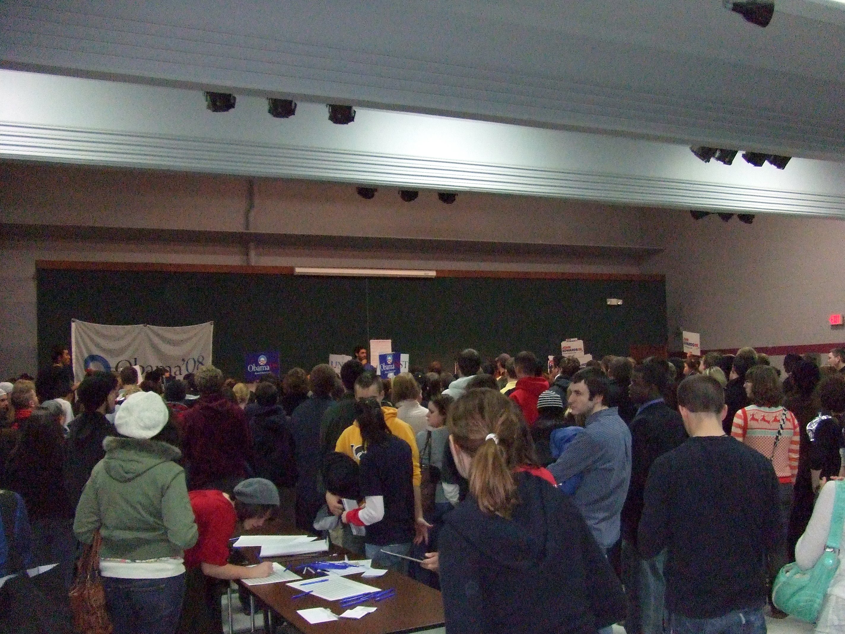 A Democratic caucus in Iowa, illustrating the physically engaging and public nature of caucus gatherings compared to the private experience of traditional secret-ballot primary elections.