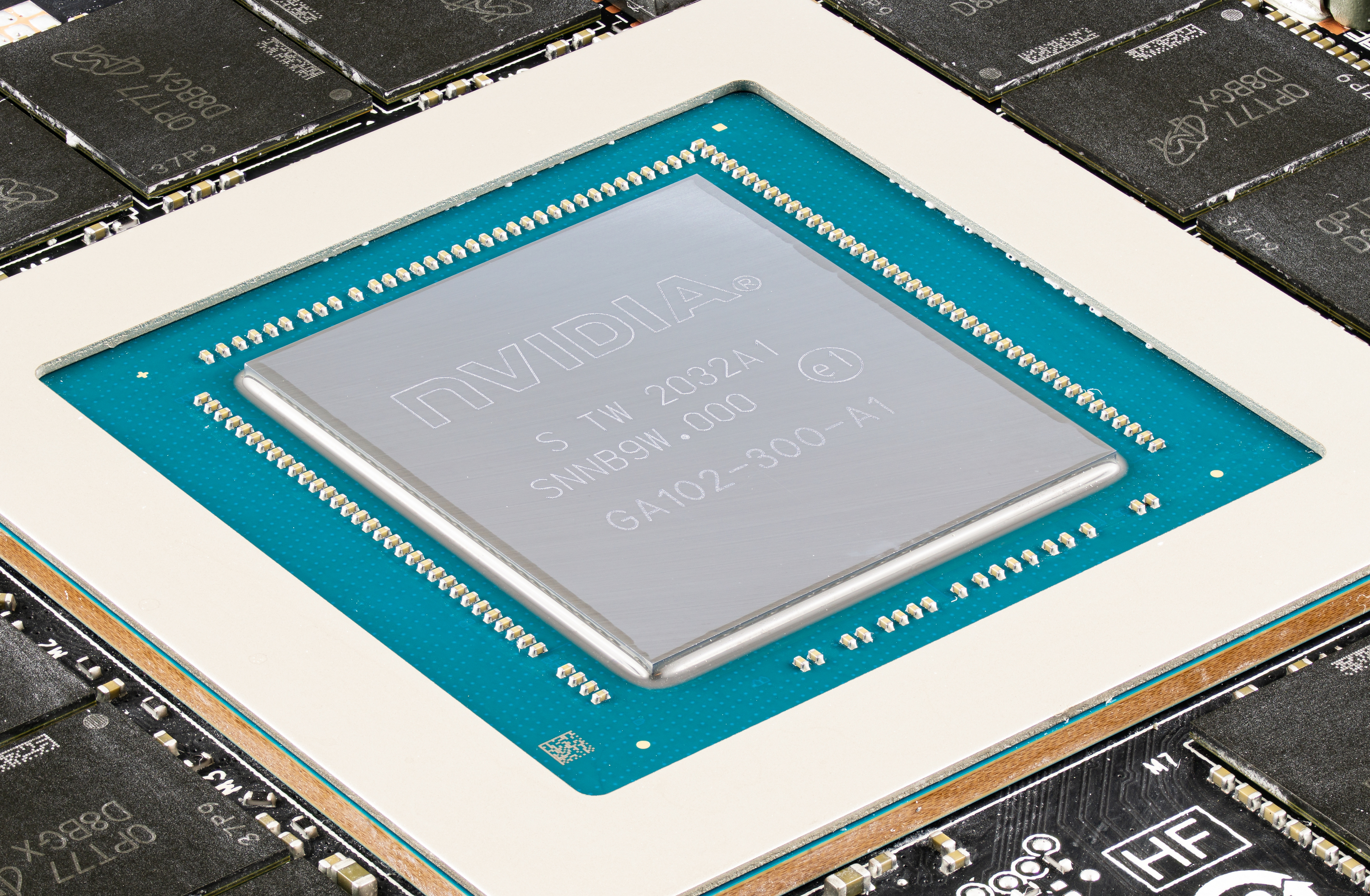 A modern Graphics Processing Unit (GPU) die surrounded by dedicated Video Random Access Memory (VRAM) chips, a hardware necessity for rendering visually demanding applications like graphic design or video editing software.