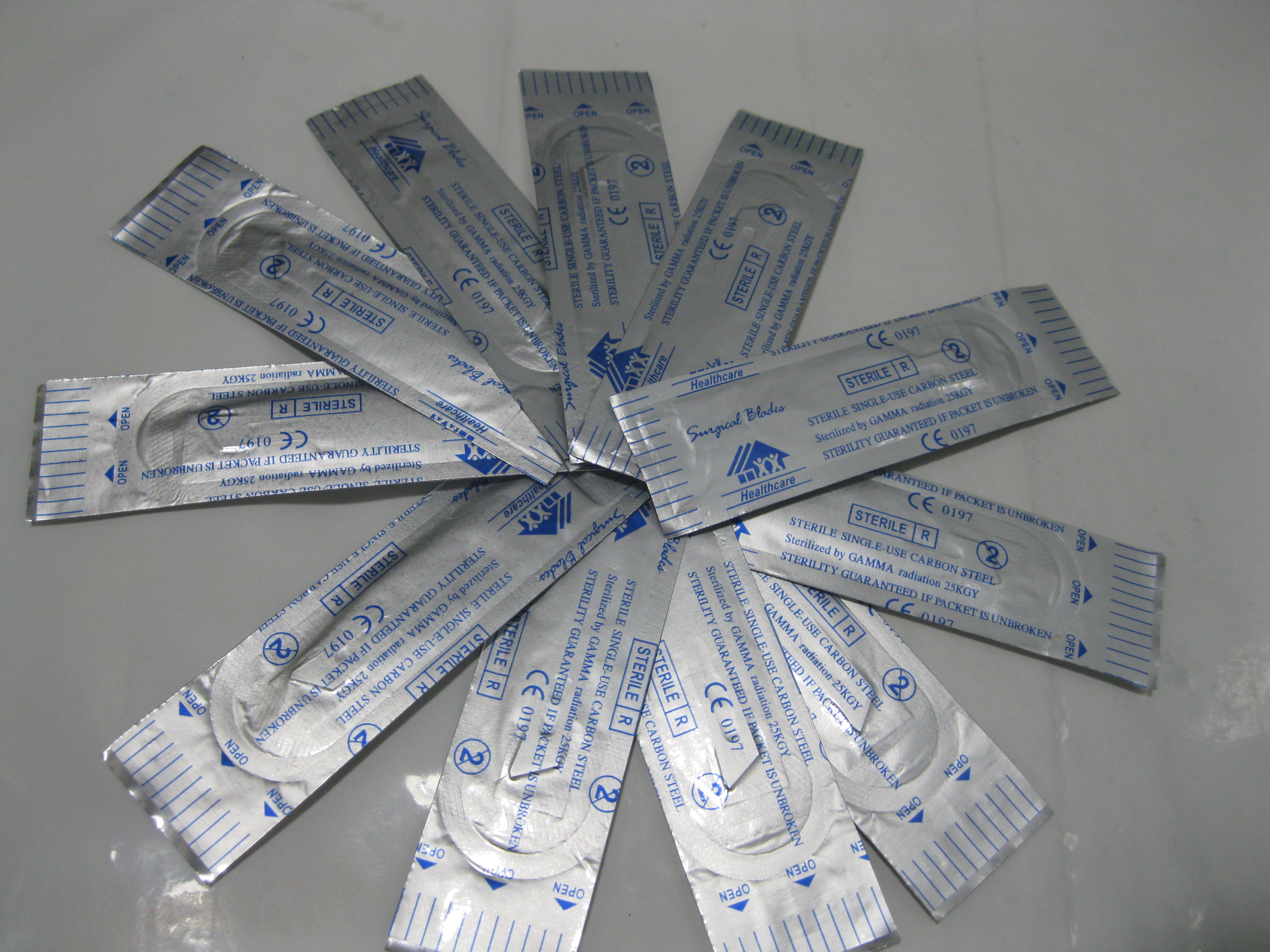 Sterile surgical instruments packaged to maintain a barrier against microorganisms. Any tear, puncture, or moisture on the wrapper immediately renders the contents unsterile.