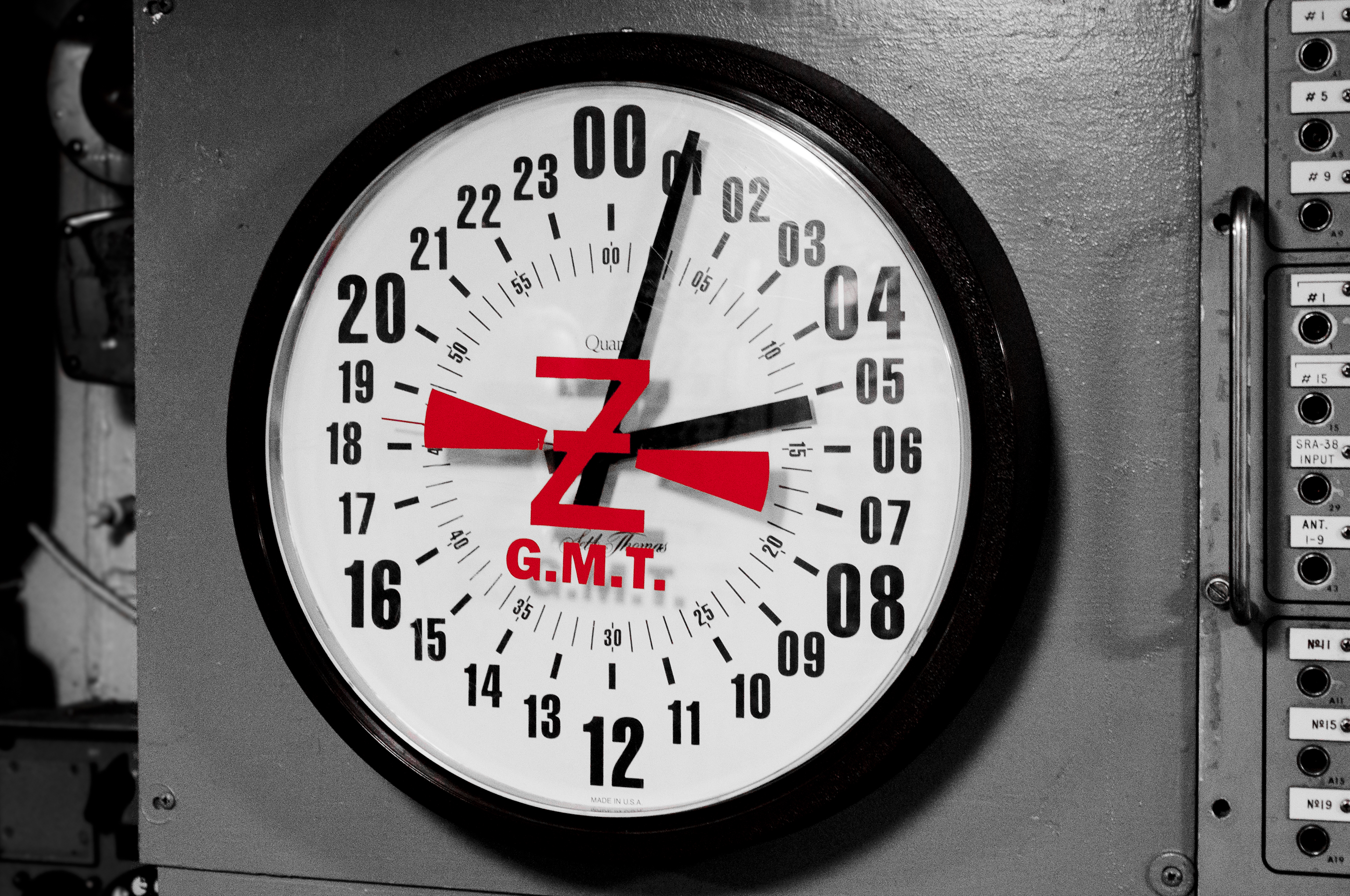 A 24-hour analog clock aboard the USS Midway. By displaying the full 24-hour cycle on a single continuous dial, this format eliminates the structural need for ambiguous a.m. and p.m. designations.