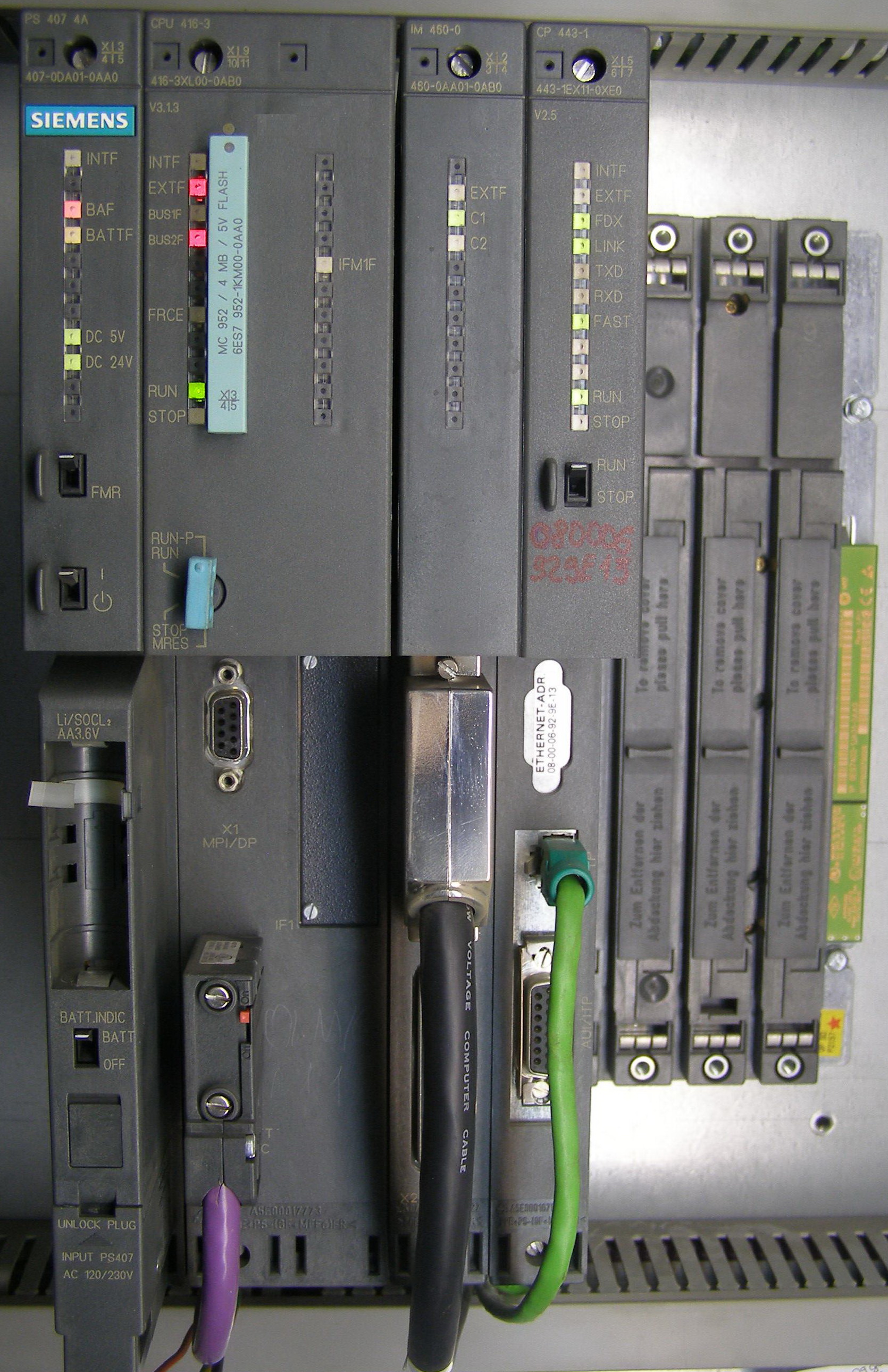 Programmable Logic Controllers (PLCs), like the modular hardware unit shown here, manage delicate industrial operations and can physically halt production if disrupted by standard IT scanning tools.
