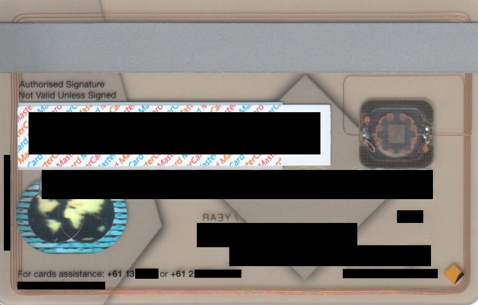 A smart card held to the light, revealing the embedded copper antenna coil and integrated microchip. Unlike basic RFID badges, these chips perform dynamic cryptographic handshakes to prevent signal cloning.