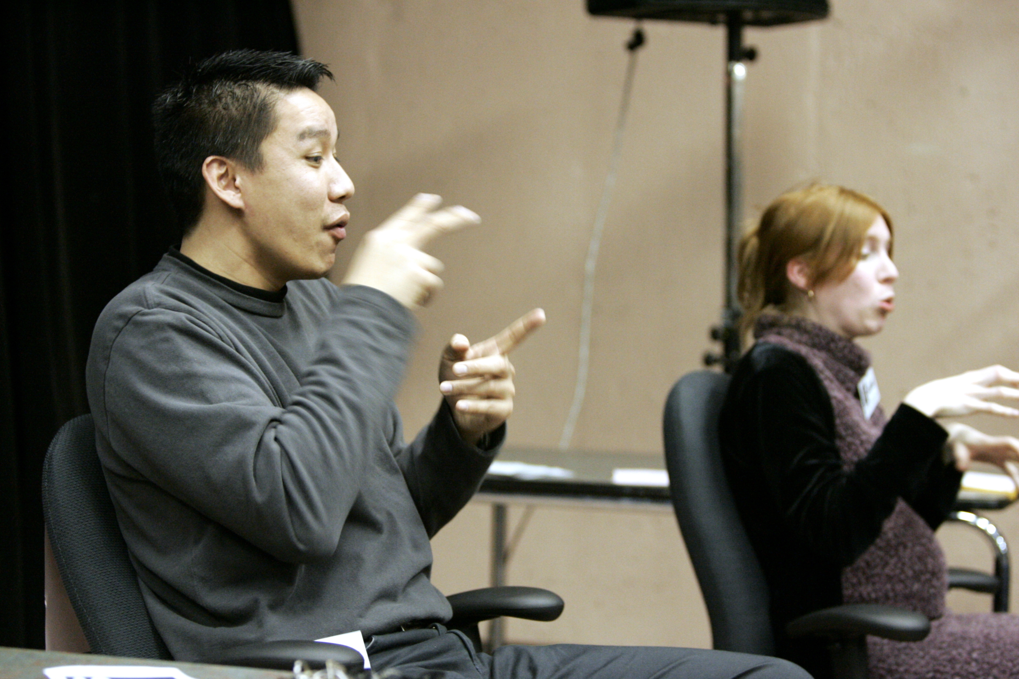 Providing sign language and language interpreters for meetings is a legally mandated accessibility requirement to ensure parents with linguistic barriers can participate equitably.