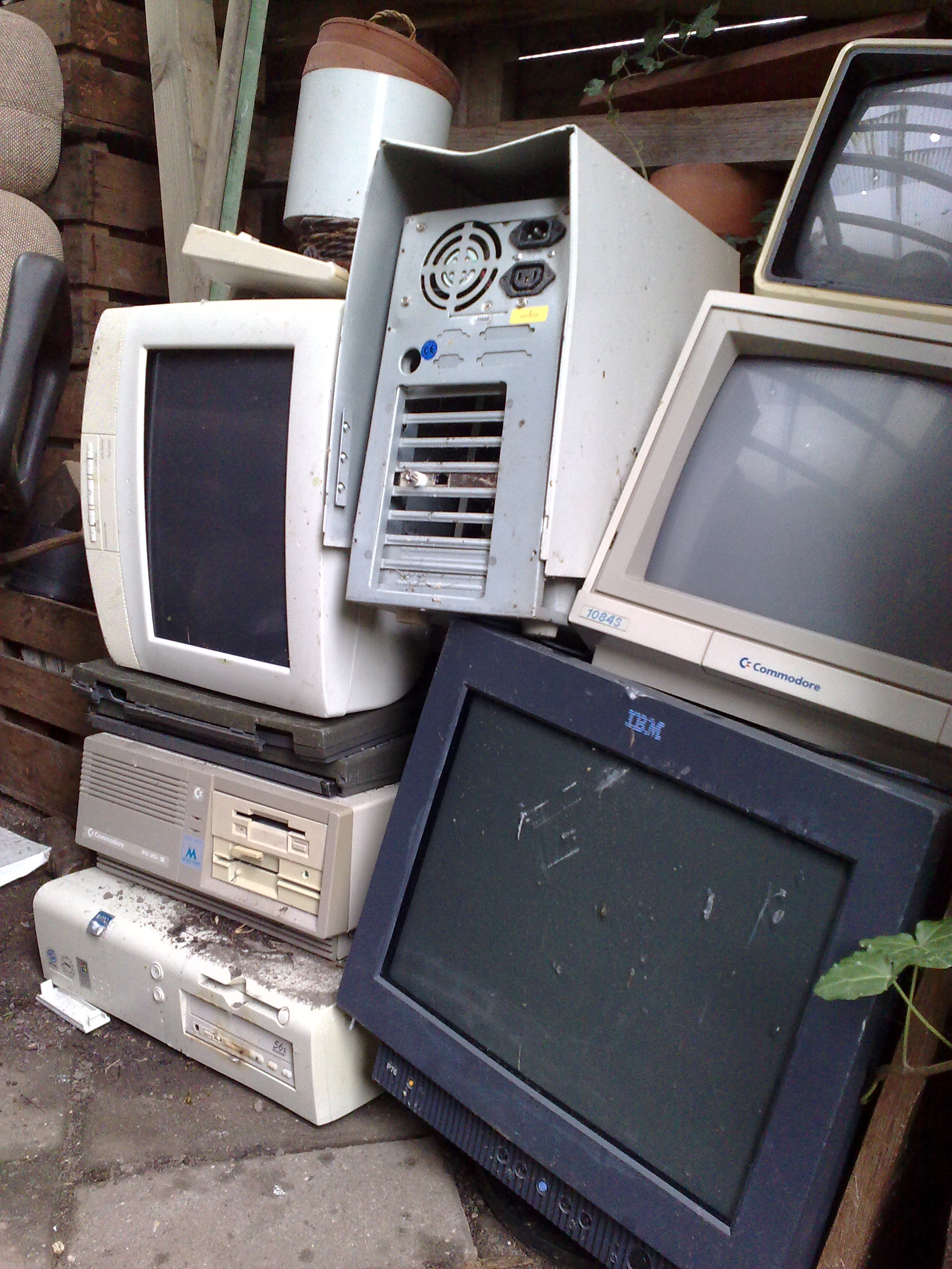 A pile of obsolete electronic waste. E-waste disposal is heavily regulated by local municipalities due to the toxic heavy metals like lead, cadmium, and lithium contained within the hardware.