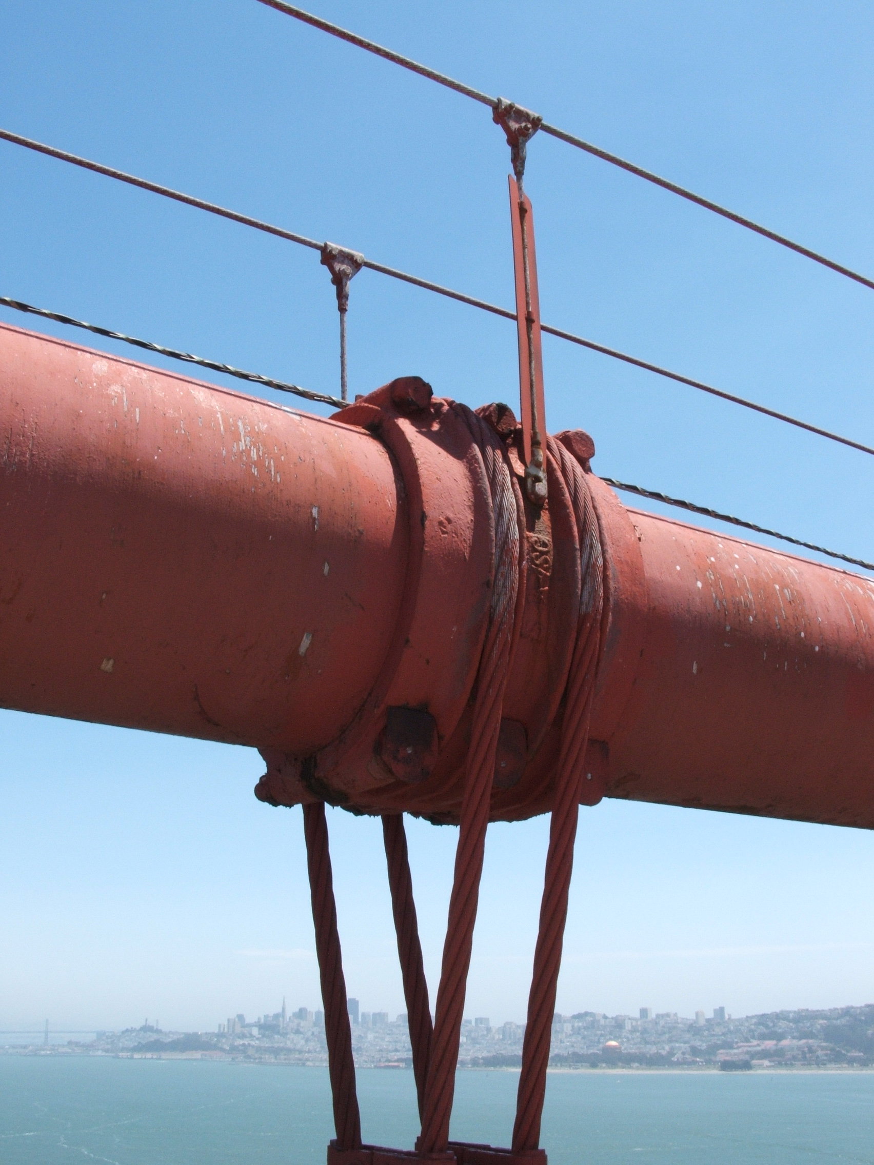 The intersecting suspender cables of a suspension bridge provide a real-world example of how lines intersecting in space are governed by strict mathematical symmetry.