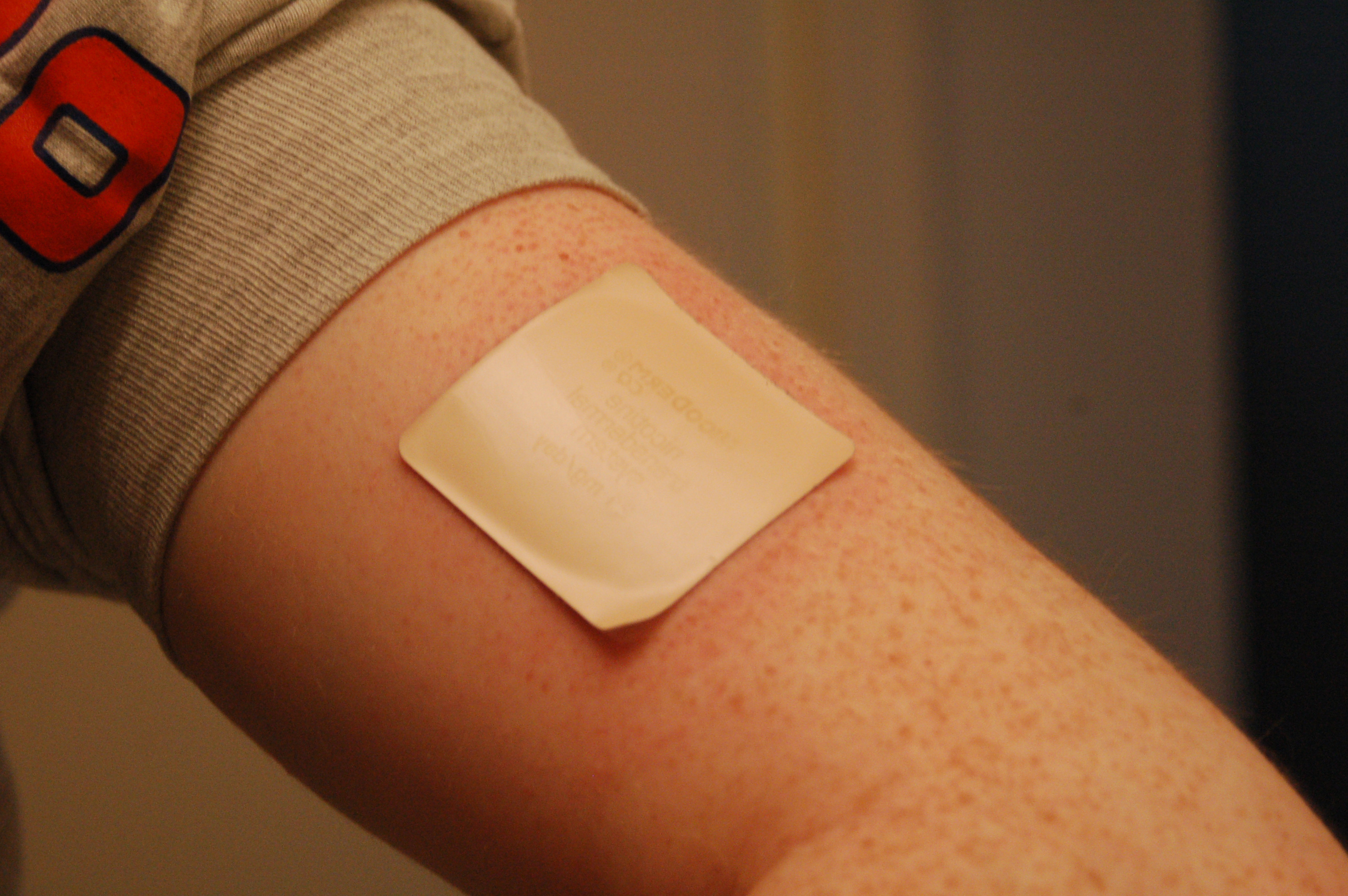 Transdermal nicotine patches provide a steady dose of nicotine to mitigate physical withdrawal symptoms during smoking cessation attempts.