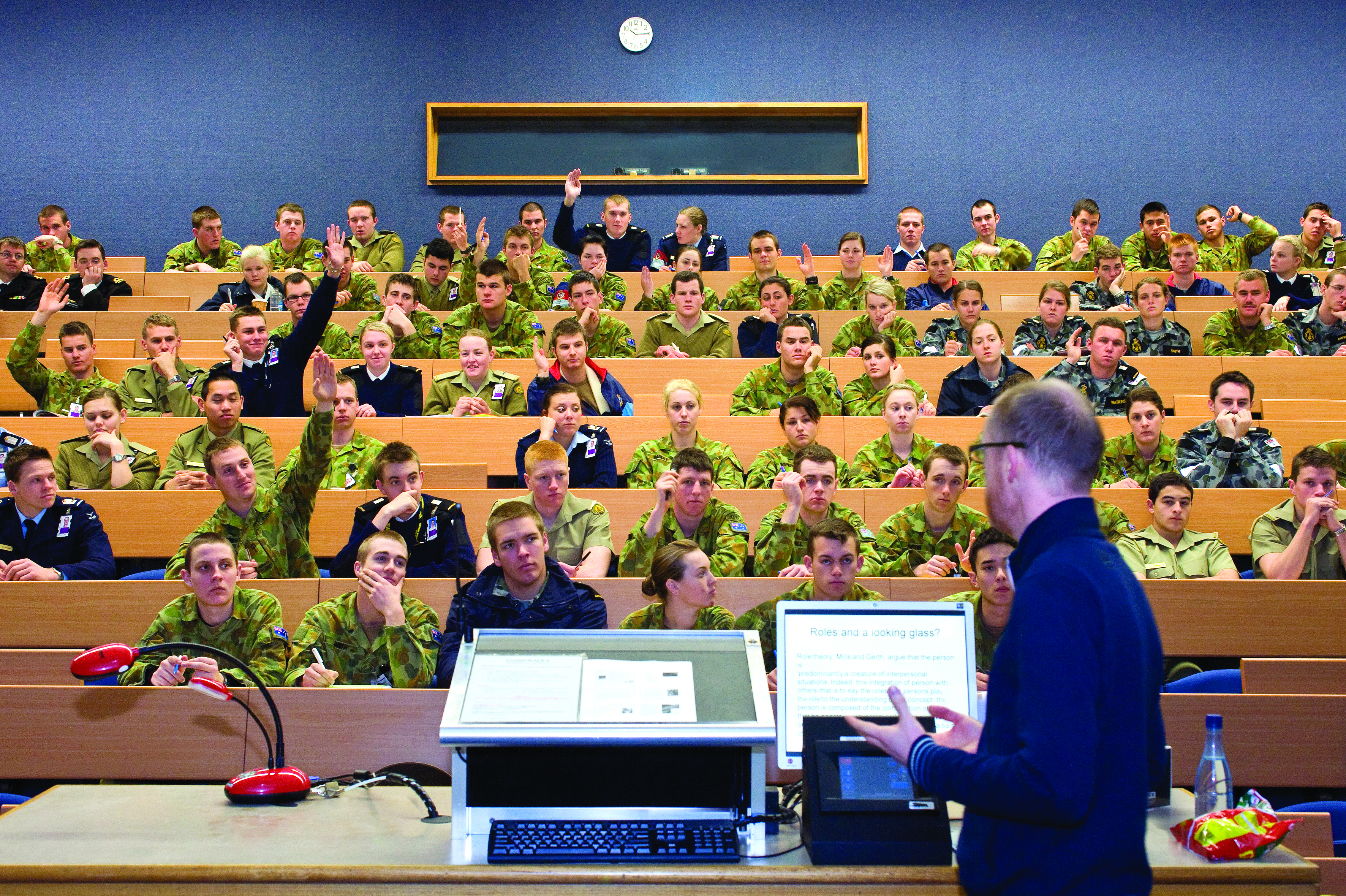 While the spoken words of a lecture qualify as an unscripted public appearance, any physical handouts or slides distributed to the audience may trigger strict retail communication rules if given to more than 25 retail investors.