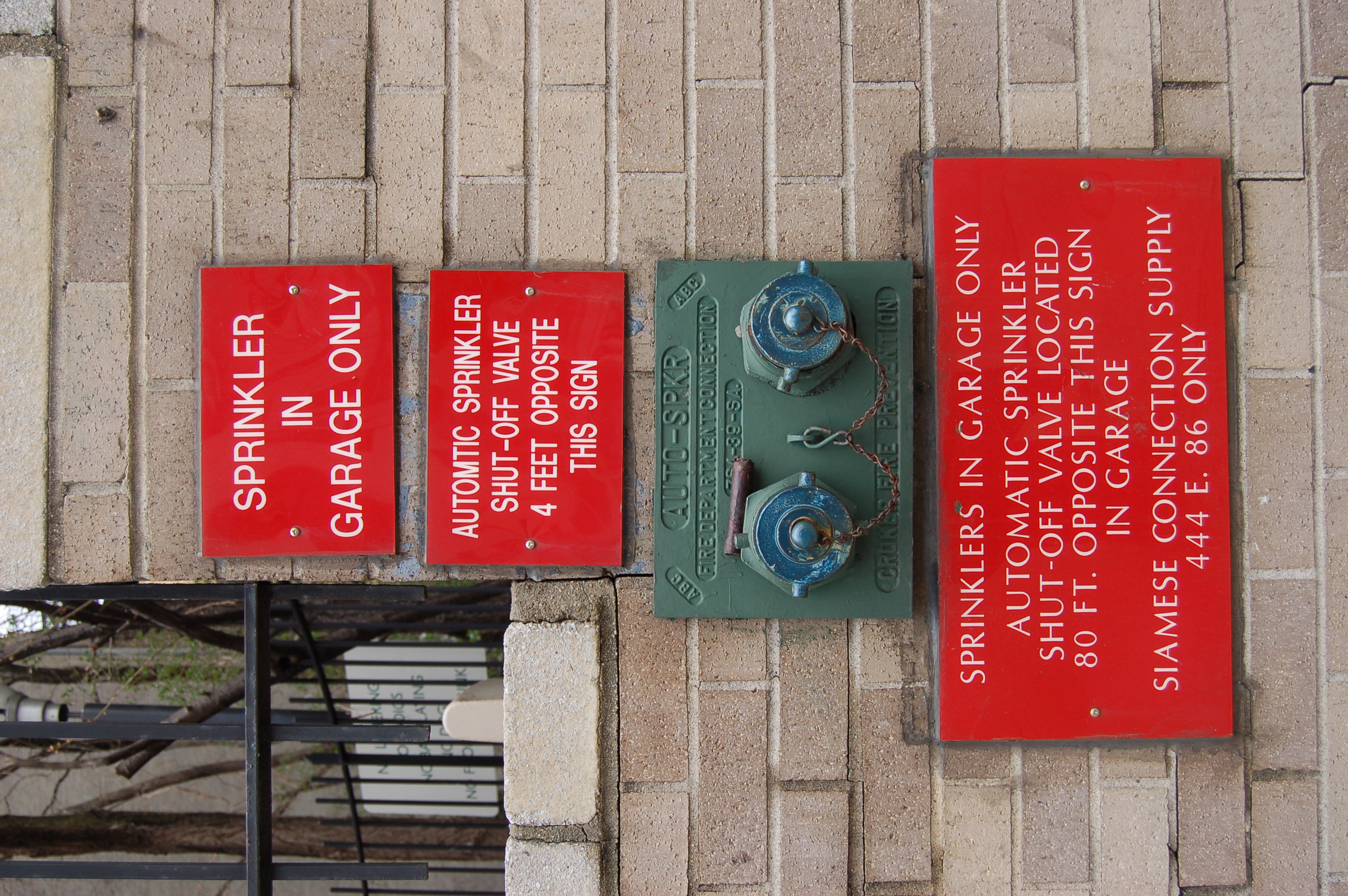 A fire sprinkler system installed in a New York City garage. Routine inspections of fire suppression infrastructure are legally mandated to maintain building code compliance and protect life.