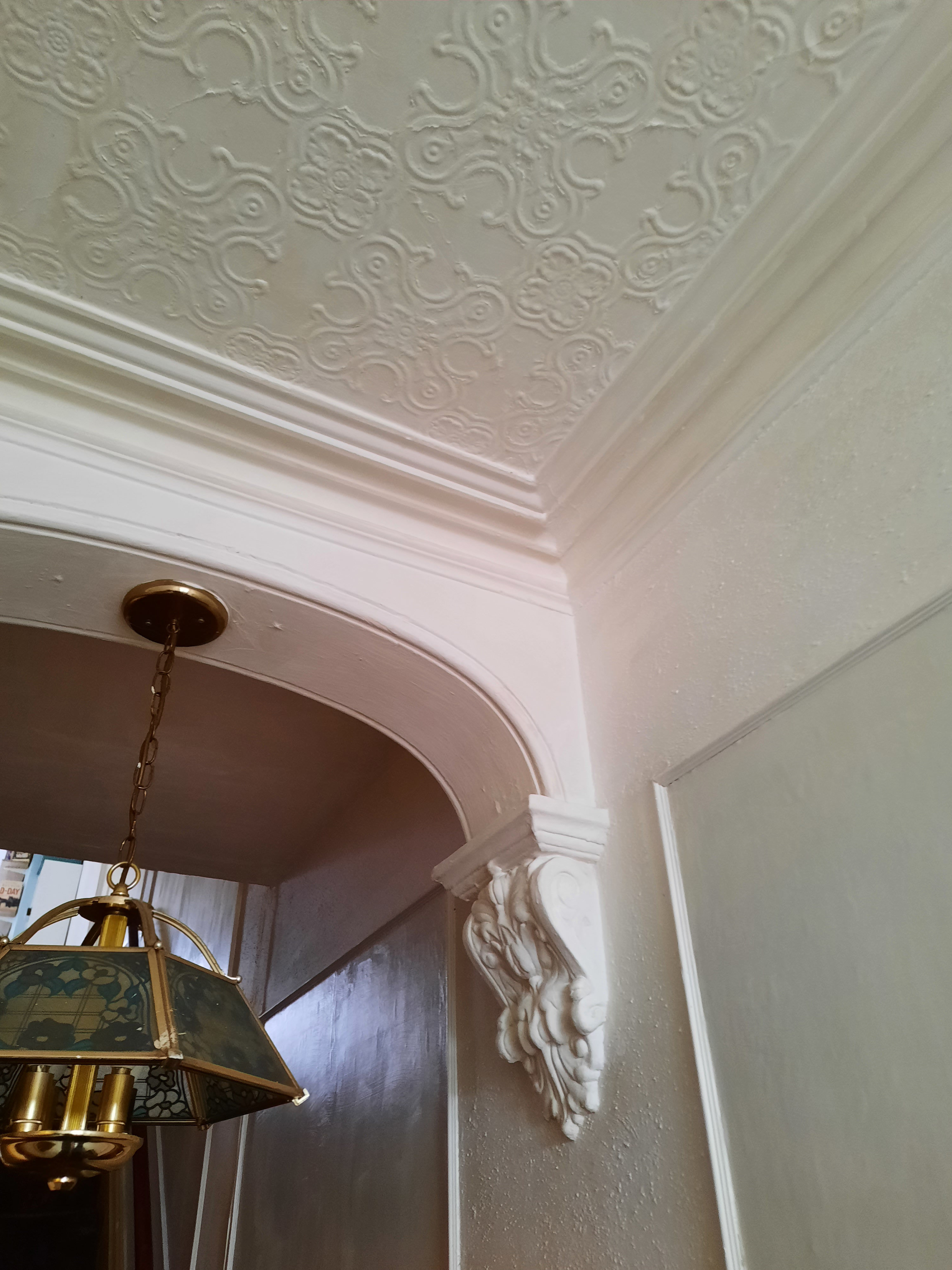Reproduction cost requires an appraiser to price out exact historical materials and craftsmanship, such as these ornate 19th-century moldings, which is significantly more expensive and complex than calculating modern replacement cost.