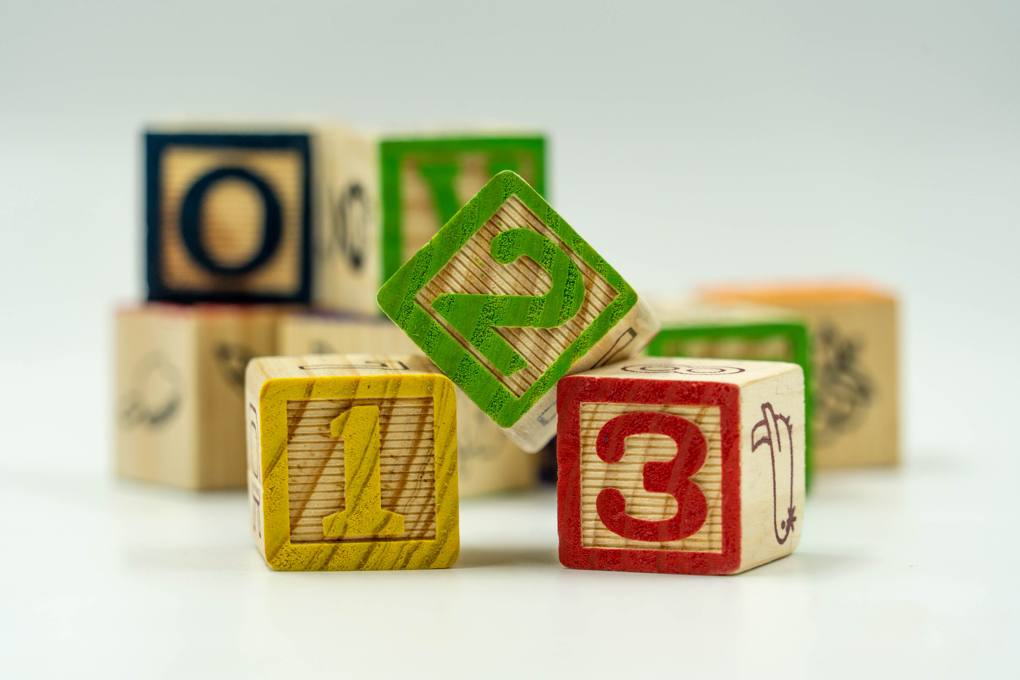 Physical manipulatives, such as number blocks, provide the tangible scaffolding necessary for children to translate rote verbal recitation into genuine rational counting.