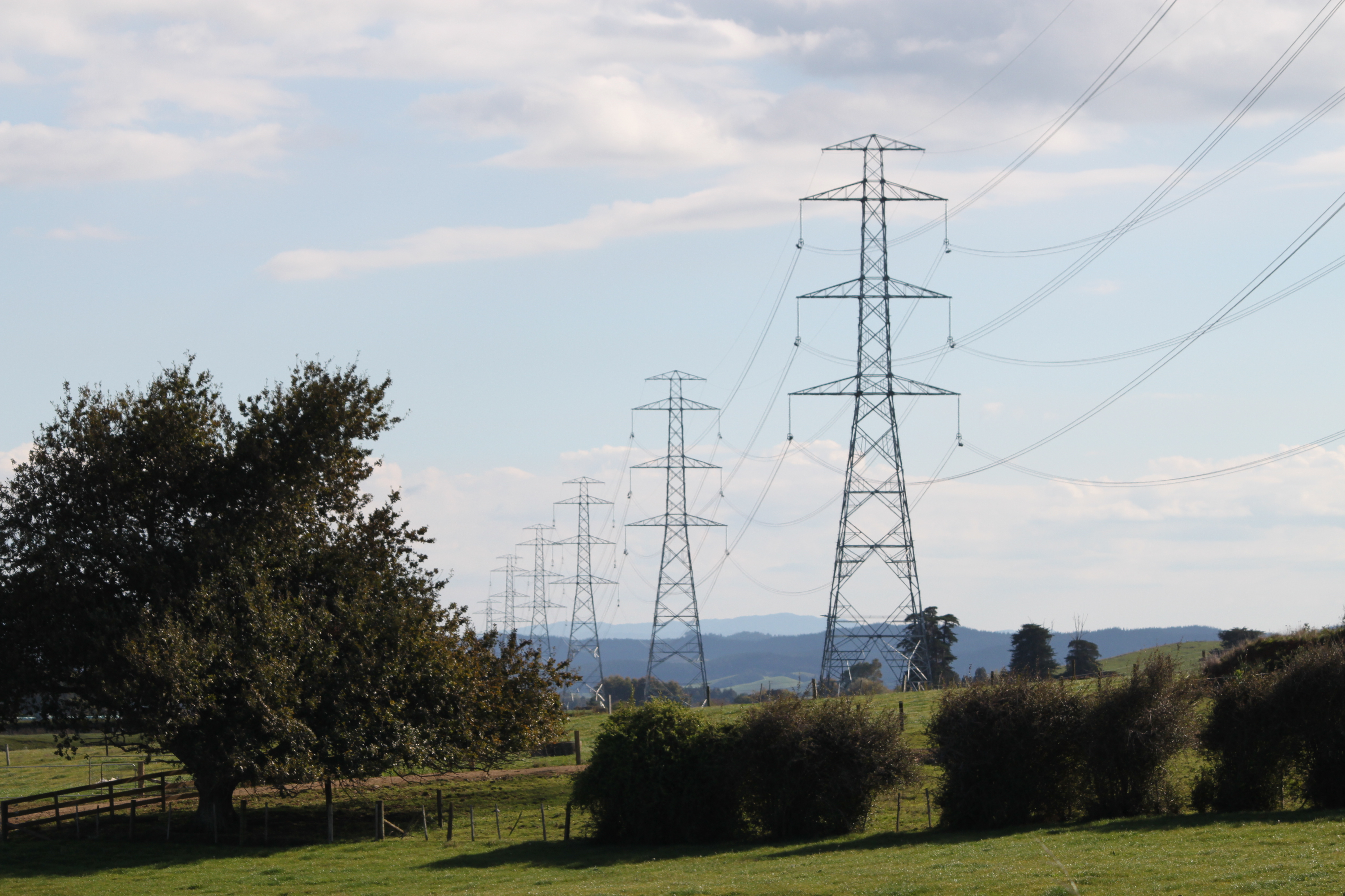 Utility infrastructure, such as electrical transmission lines, frequently forms natural monopolies because massive fixed costs make it highly inefficient for multiple competing firms to operate in the same area.