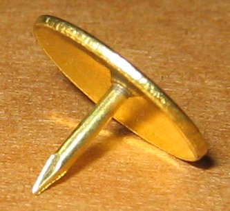 Flipping an asymmetrical object, such as a thumbtack, generates outcomes that are not equally likely, illustrating a scenario where the standard theoretical probability formula fails.
