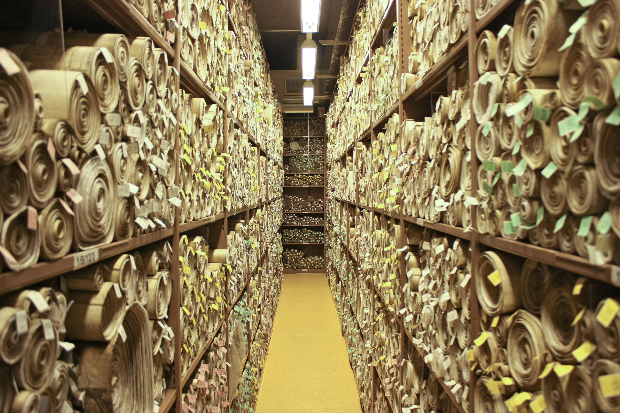 Scrolls of Acts of Parliament held in the Parliamentary Archives — the physical embodiment of the idea running through this topic: an external norm binds the UK only because, and only to the extent that, an Act of Parliament says so.