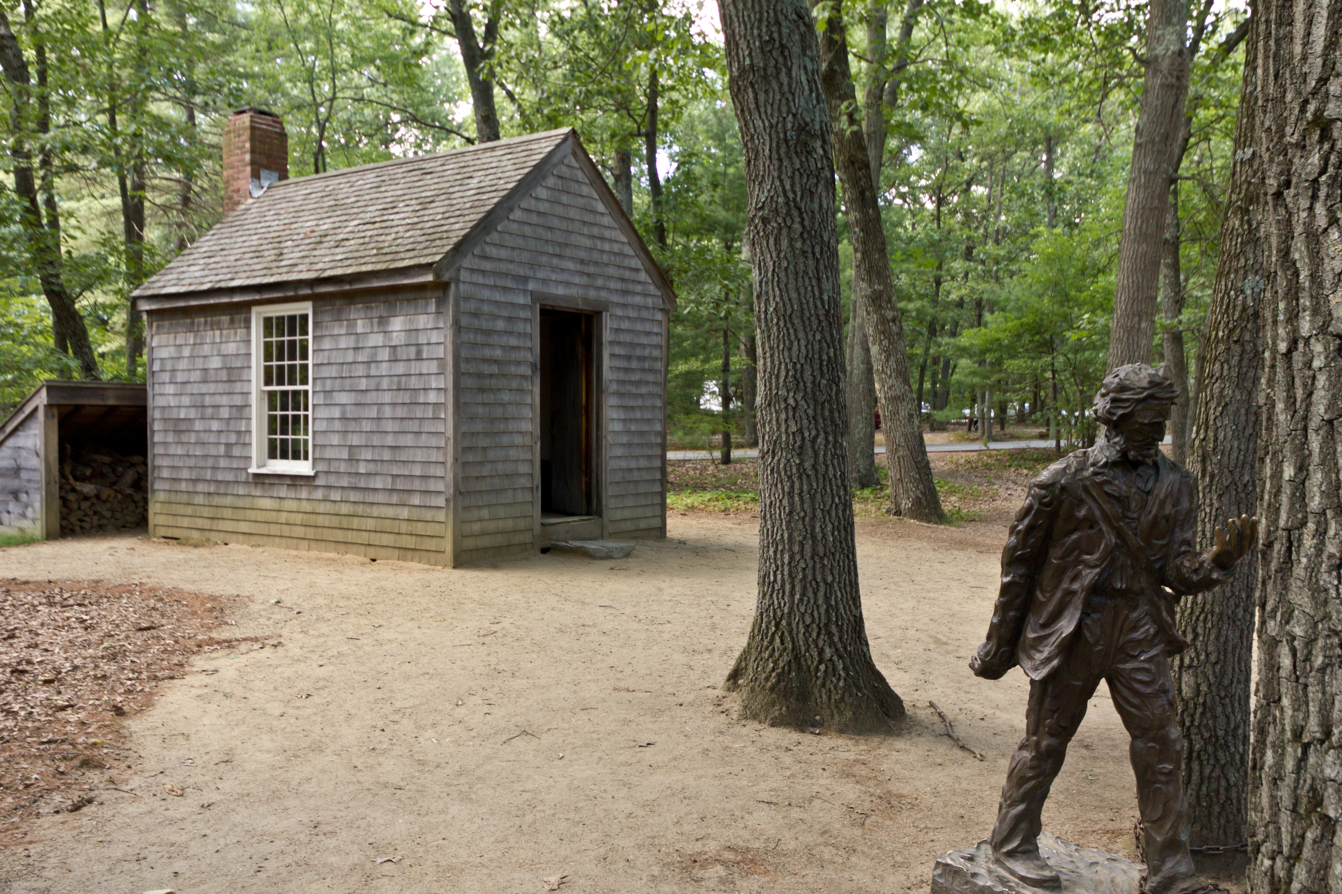 A replica of Henry David Thoreau’s cabin at Walden Pond. Visualizing this small, isolated structure helps students grasp the physical reality of his experiment in self-reliance.