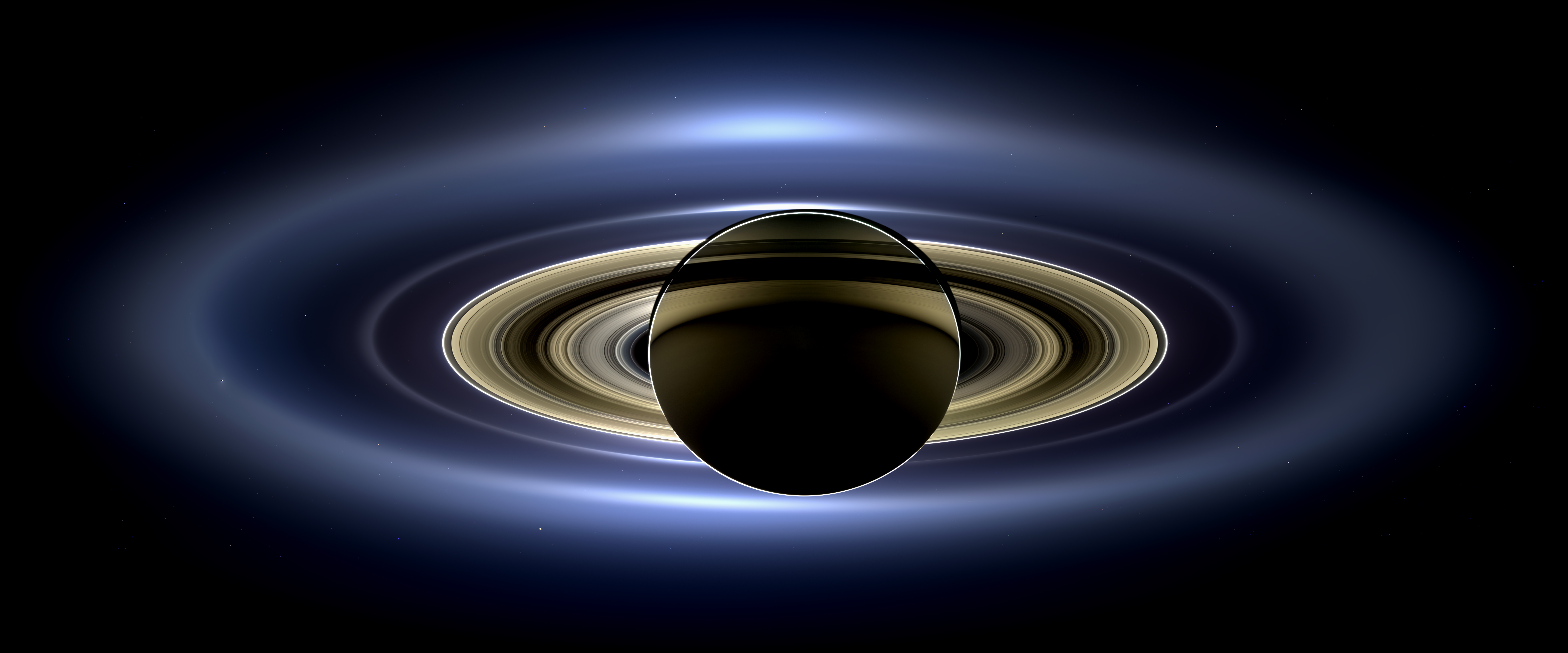 Saturn's rings viewed from the Cassini orbiter. Like a telescope bridging the gap between human vision and the cosmos, assistive technology acts as the necessary interface for a neurodivergent mind navigating an inaccessible curriculum.