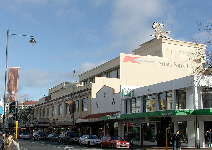 A shopping centre with its anchor tenants' logos displayed above the entrance — the kind of pre-let anchor tenant deal an agreement for lease is designed to lock in before the units are even built.