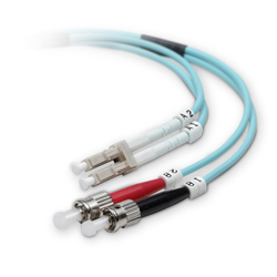 LC optical fiber connectors (top) use a plastic retaining bracket to bind two strands into a duplex pair. This clip can be removed to manually swap the transmit and receive strands.