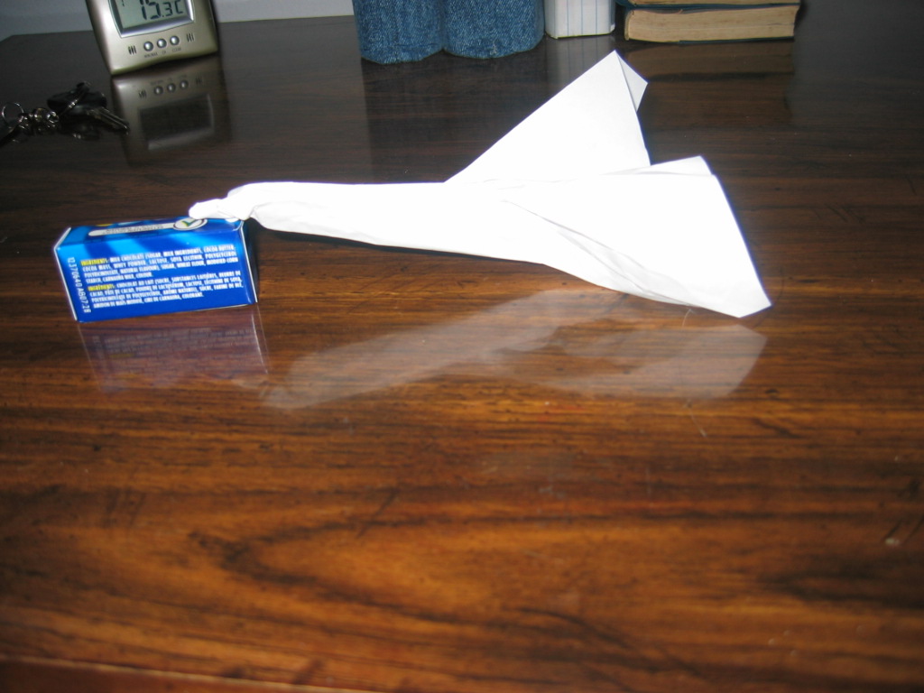 Testing an asymmetrical paper airplane prototype yields empirical data on how specific variables—like wing shape or balance—affect the dependent variable of flight trajectory.