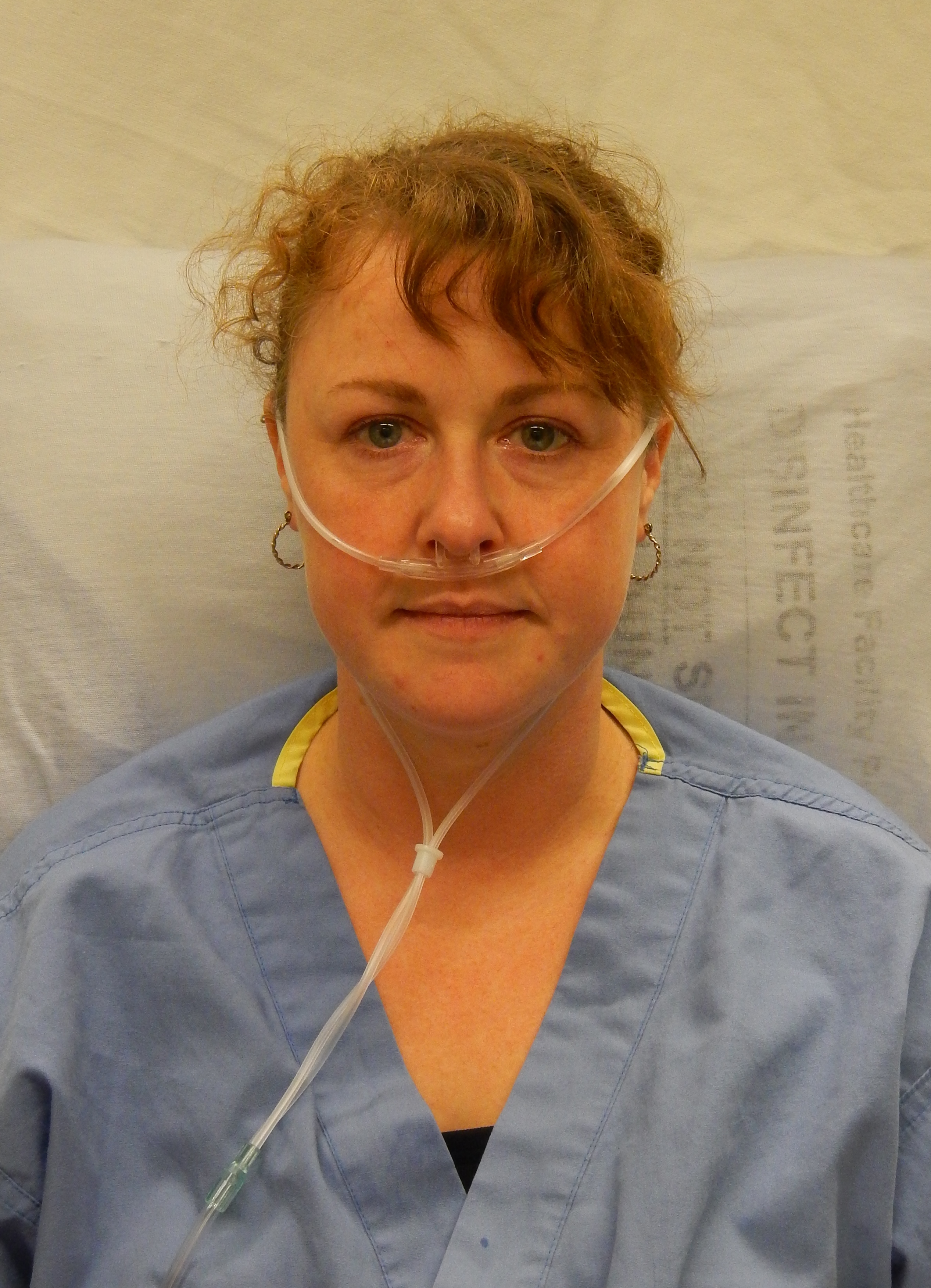 Oxygen therapy via nasal cannula is frequently used alongside low-dose morphine to manage dyspnea and provide physiological comfort during end-of-life care.
