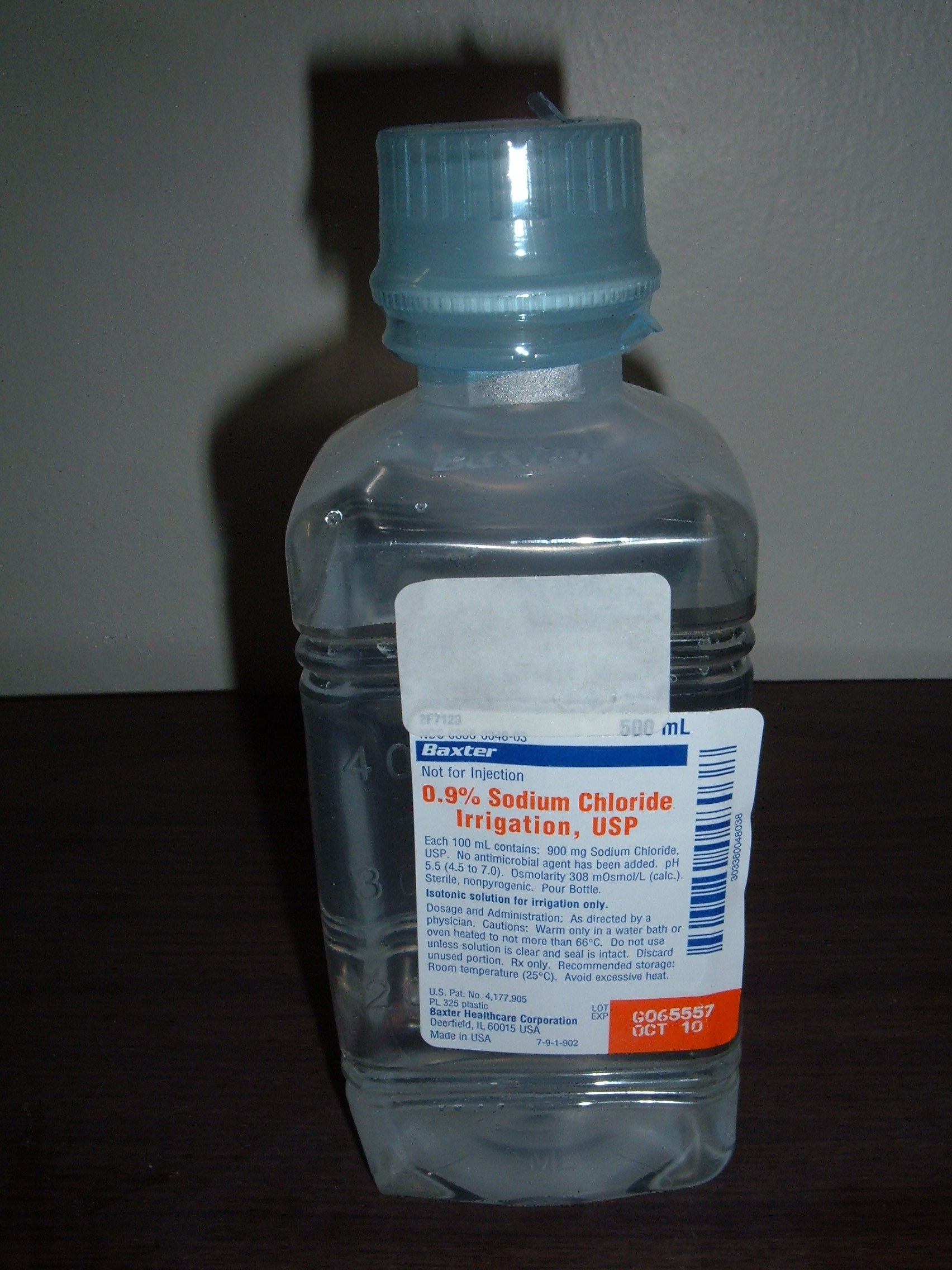 A 0.9% sodium chloride saline solution represents a proportion of 0.9 parts salt per 100 parts total solution.