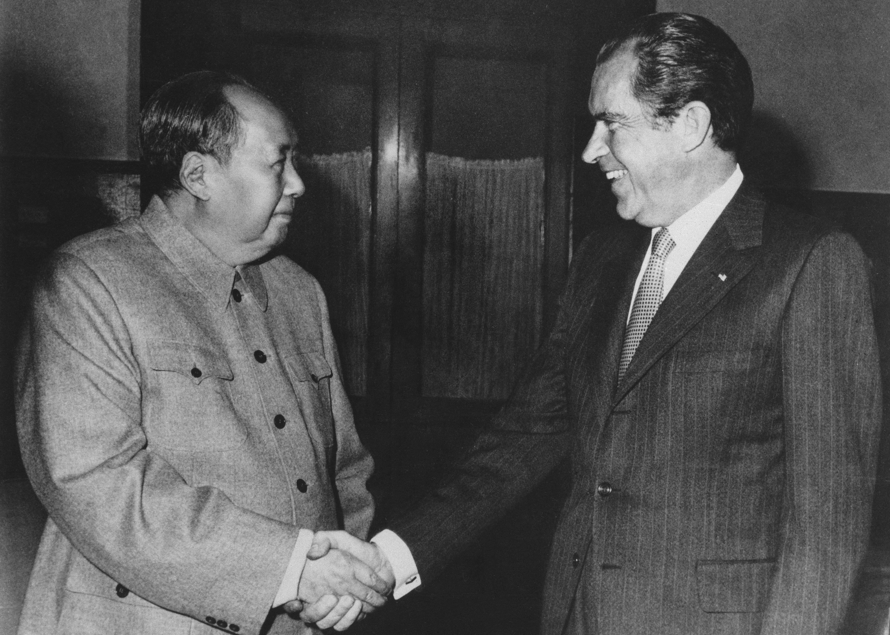 U.S. President Richard Nixon meeting with Chinese Communist Party Chairman Mao Zedong in 1972 to normalize diplomatic relations.