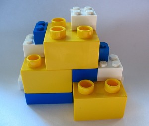 APIs act as standardized interfaces, allowing independently developed frontend clients and backend microservices to connect securely like interlocking building blocks.