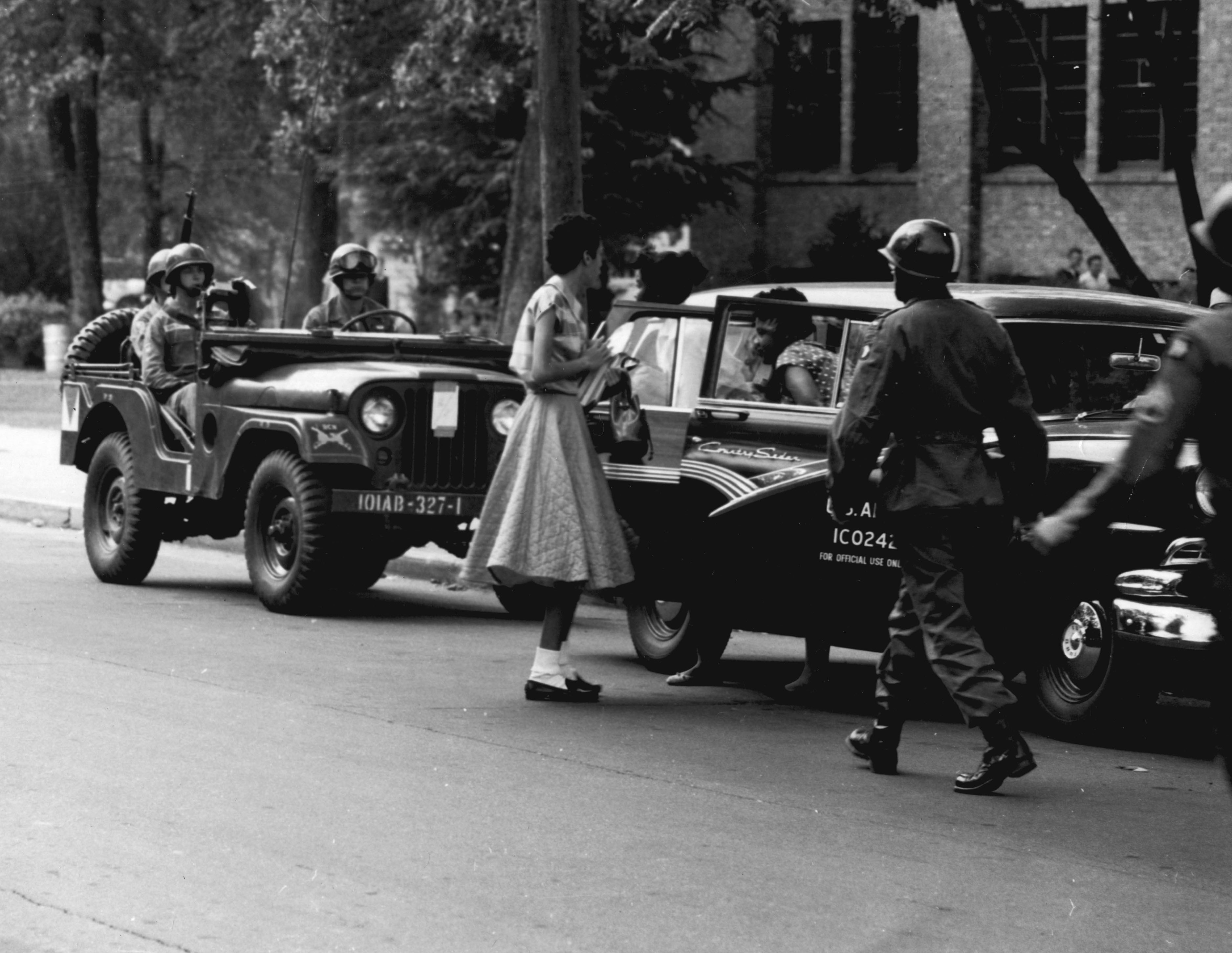 Members of the 101st Airborne escorting the Little Rock Nine to class, a visible demonstration of federal supremacy overriding local segregationist mobs.