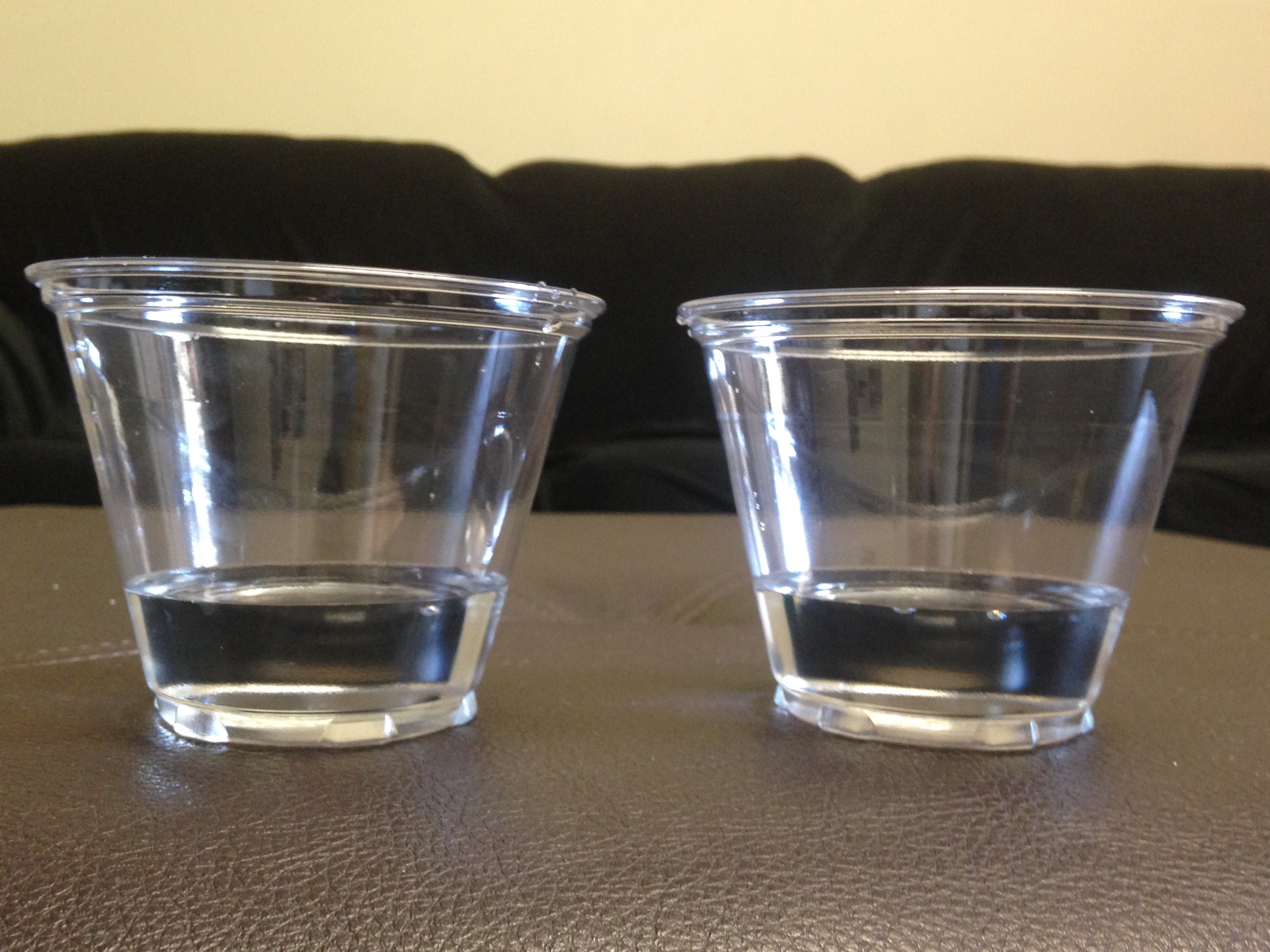 In classic Piagetian conservation tasks, such as comparing liquid volumes in different containers, a student must recognize that total continuous or discrete quantity remains mathematically constant despite drastic visual changes in physical shape or spatial arrangement.