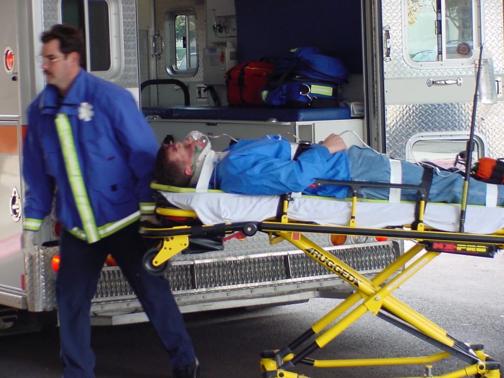 A patient being transported on a stretcher. A client retains the right to withdraw consent at any point, even while en route to the operating room, at which point all transport and procedures must halt.