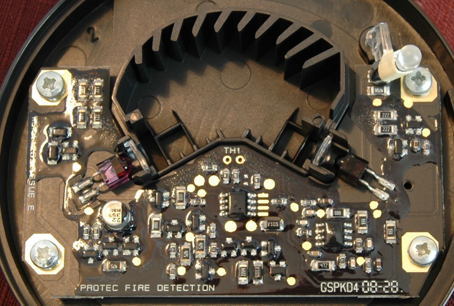 An optical (photoelectric) smoke detector with its cover removed. Massachusetts generally favors these over ionization alarms due to their responsiveness to smoldering fires and lower rate of nuisance alarms.