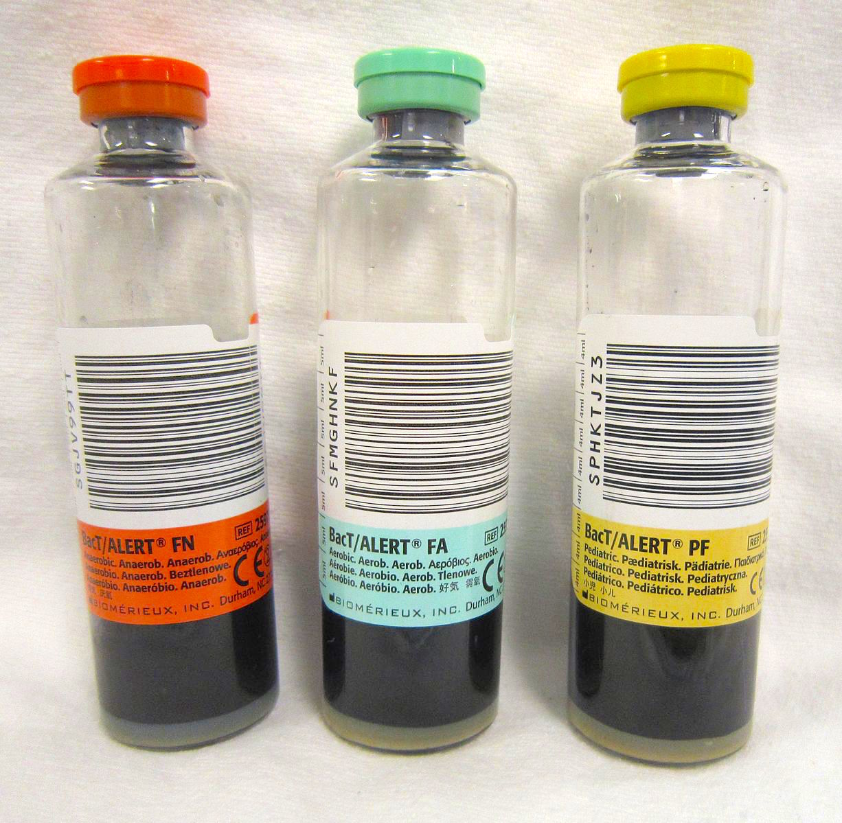 Blood culture bottles are used to identify the specific pathogen causing an infection. These diagnostic samples must be drawn before initiating broad-spectrum antibiotics to ensure accurate identification.