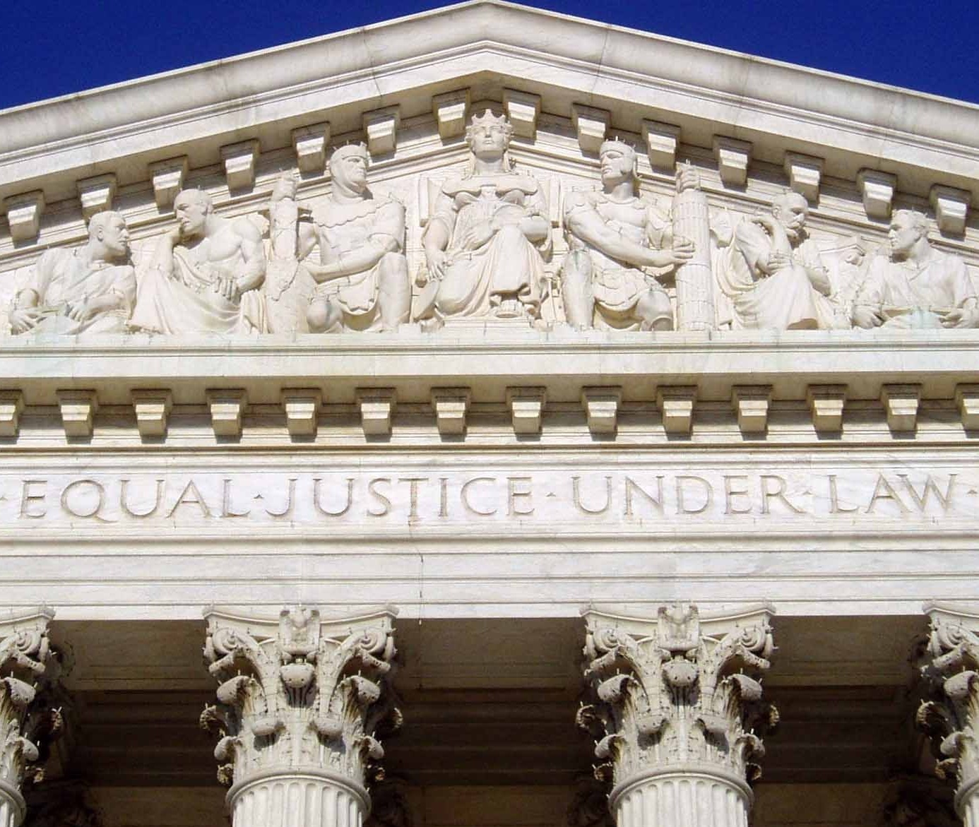 The inscription "Equal Justice Under Law" on the United States Supreme Court Building represents the core philosophy of the Fourteenth Amendment's Equal Protection Clause.