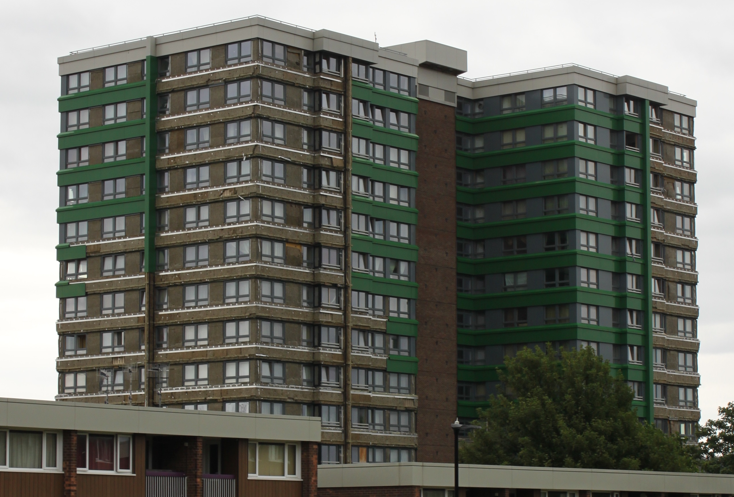 Hanover House in Sheffield, with cladding stripped after failing post-Grenfell fire safety tests — a stark illustration of why building regulations control technical construction standards regardless of whether planning permission was needed.