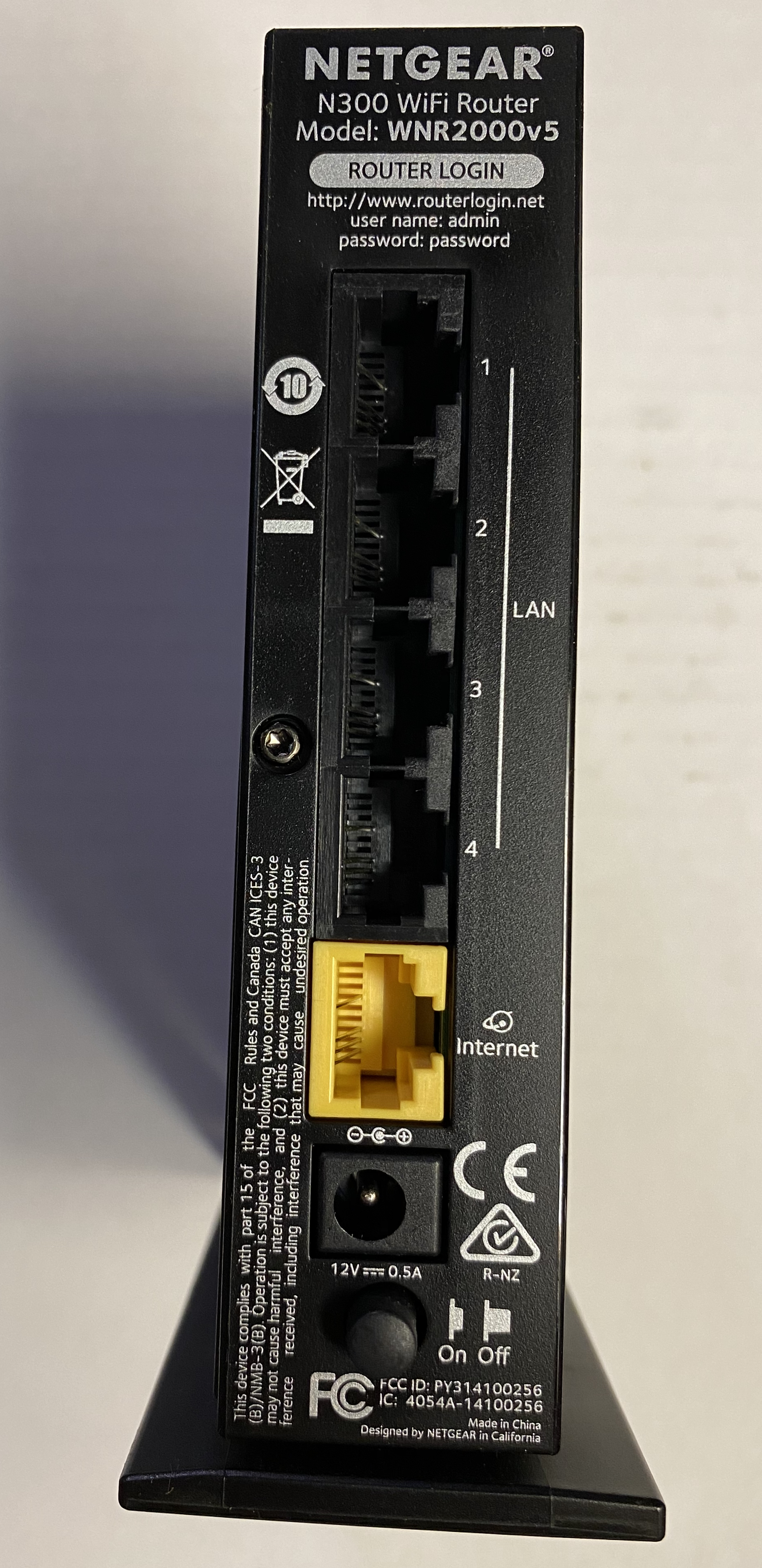 A wireless router shipping with the predictable factory-default password "password." A critical first step in hardening any system—especially IoT hardware—is changing these default credentials immediately upon deployment.