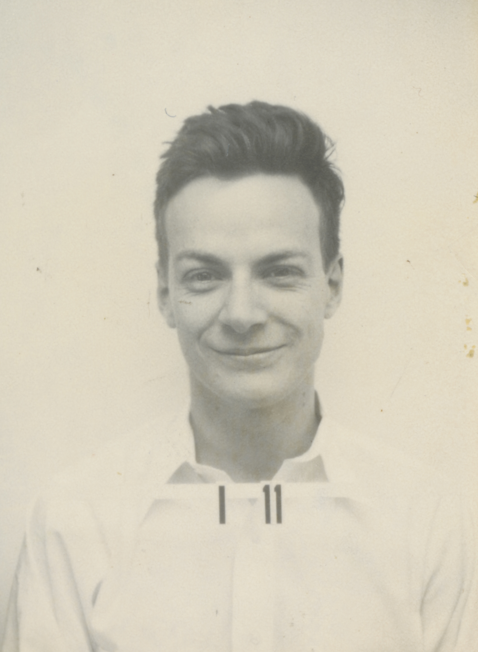 Physicist Richard Feynman's ID badge. Approaching nursing informatics with Feynman's principles helps break down complex IT rules into foundational safety concepts.