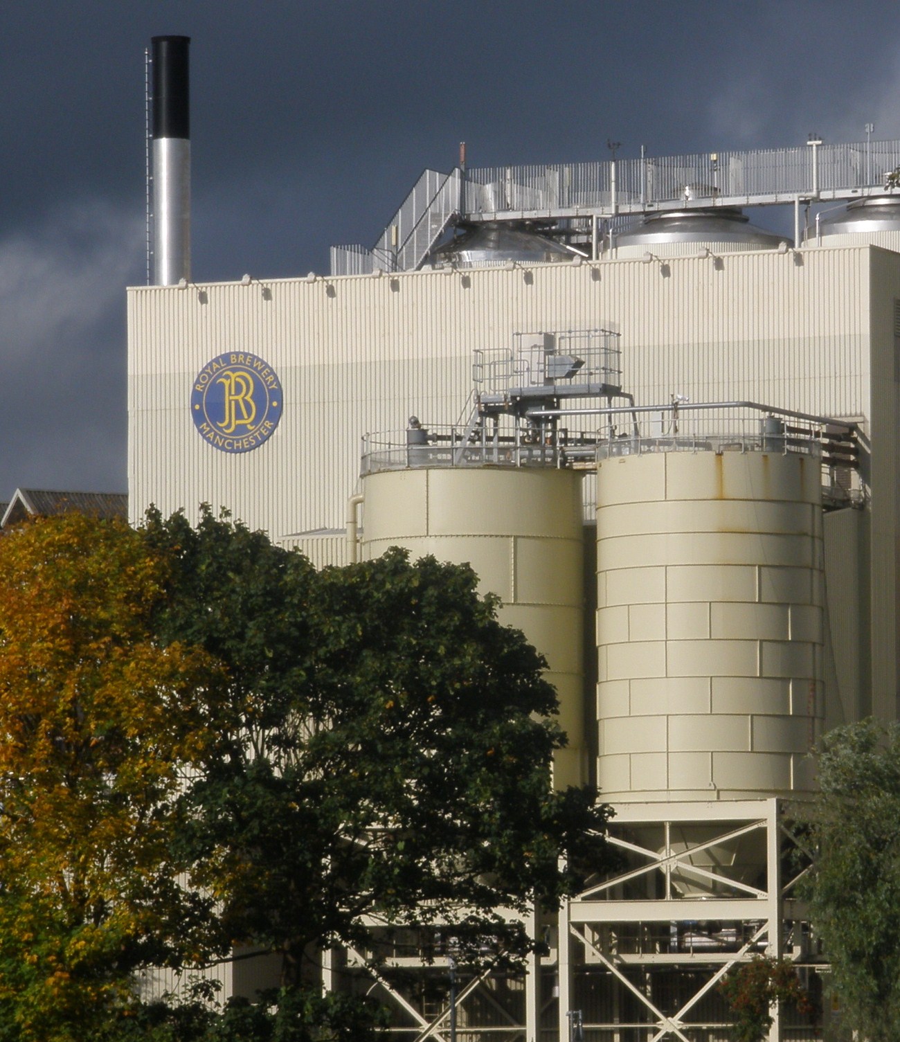 A UK brewery of the kind in Wheat v Lacon, which owned a pub run day-to-day by a manager — illustrating how a brewery and its manager can both be 'occupiers' of the same premises at once.