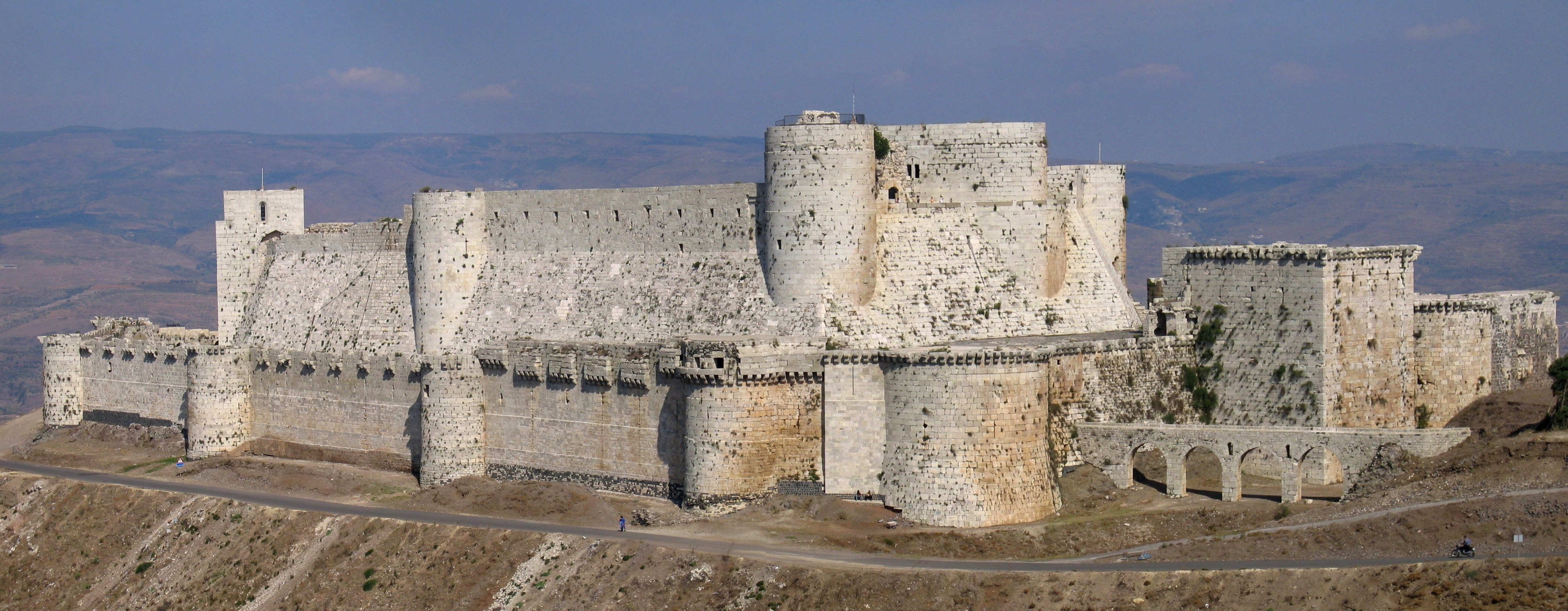 A medieval fortress illustrates the core concept of network security: establishing a strong perimeter to strictly control entry points and inspect all transit.