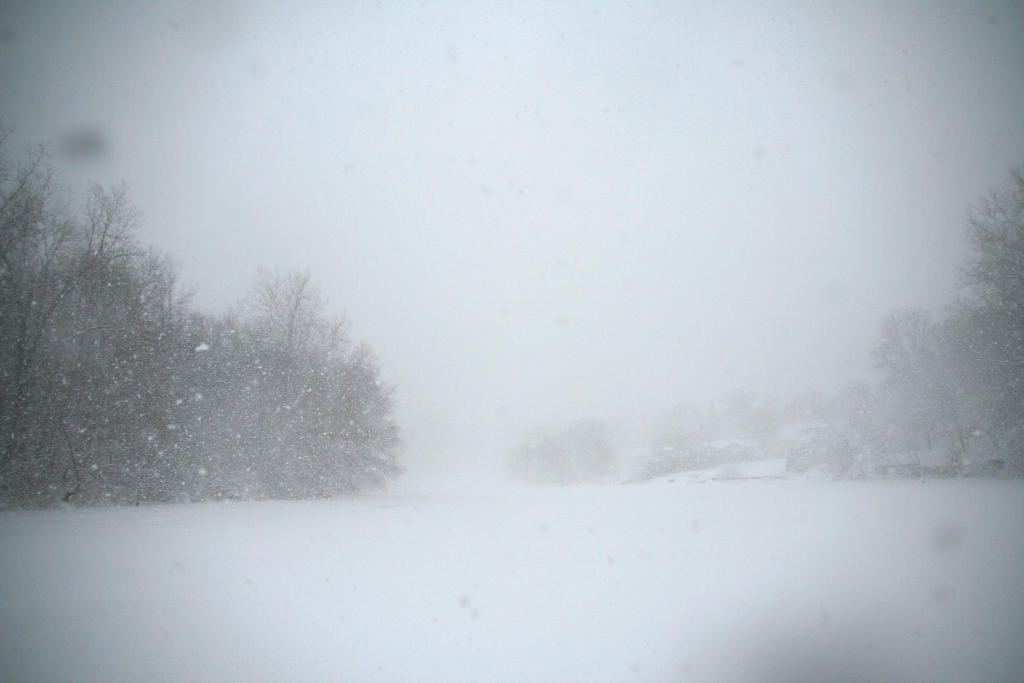 Extreme environmental settings, such as a blizzard whiteout, act as active participants in a narrative by creating survival constraints that force the plot forward.