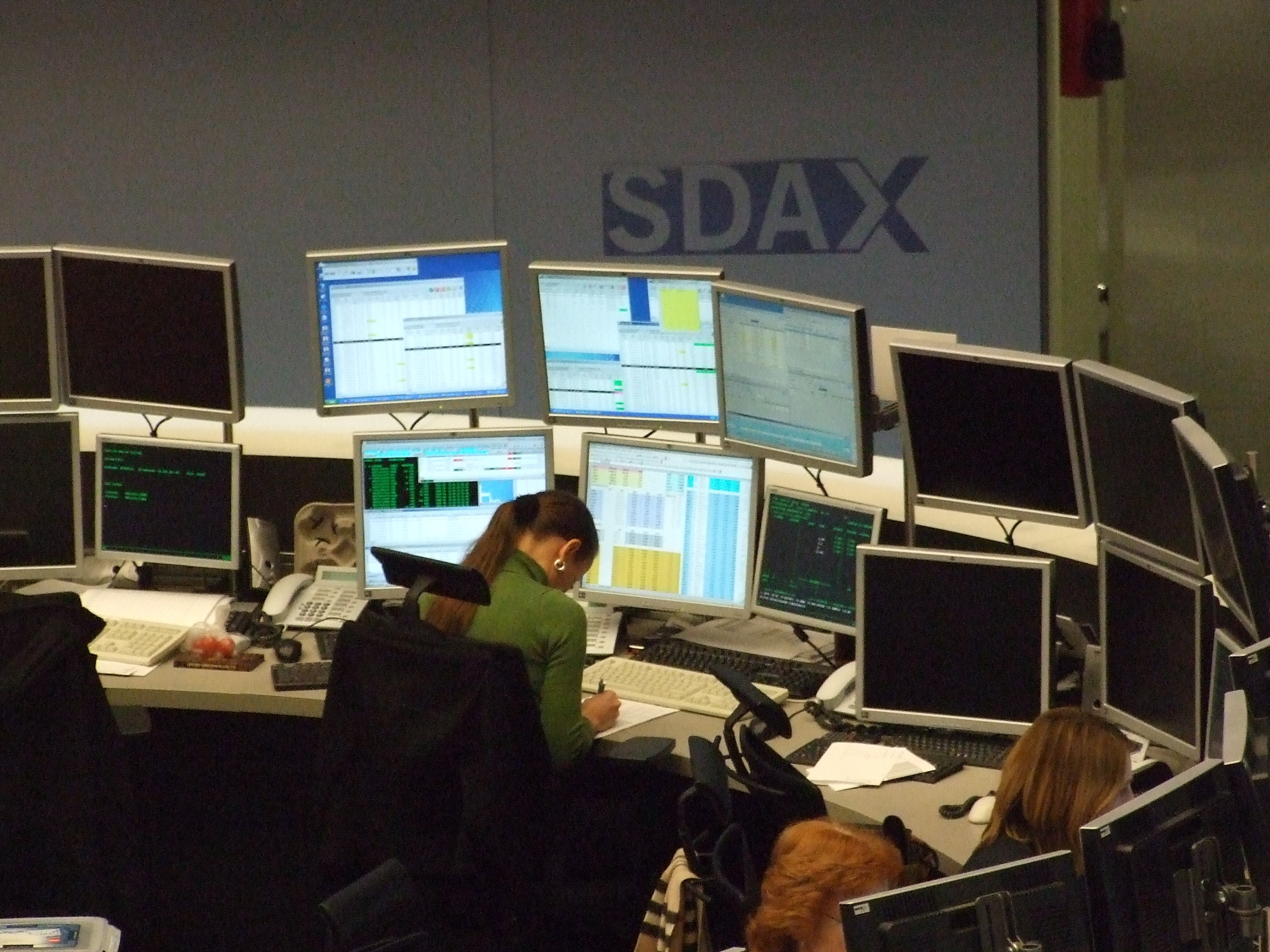 Electronic trading platforms mathematically adjust the price and quantity of open limit orders on the ex-date of corporate actions to protect investors from artificial price gaps.
