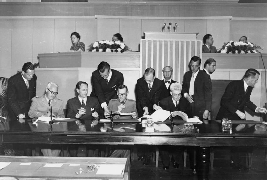 The signing of the Geneva Conventions in 1949: legislation implementing a treaty like this is construed consistently with the treaty's own purpose, drawing on its travaux préparatoires where needed.