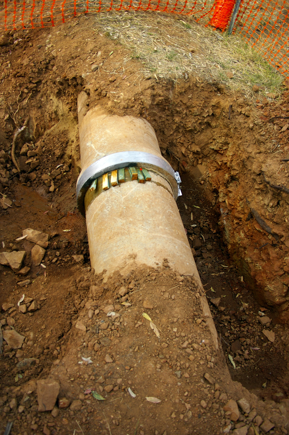 Underground municipal water mains provide the infrastructure that private residential properties must independently replicate when disconnected from the grid.