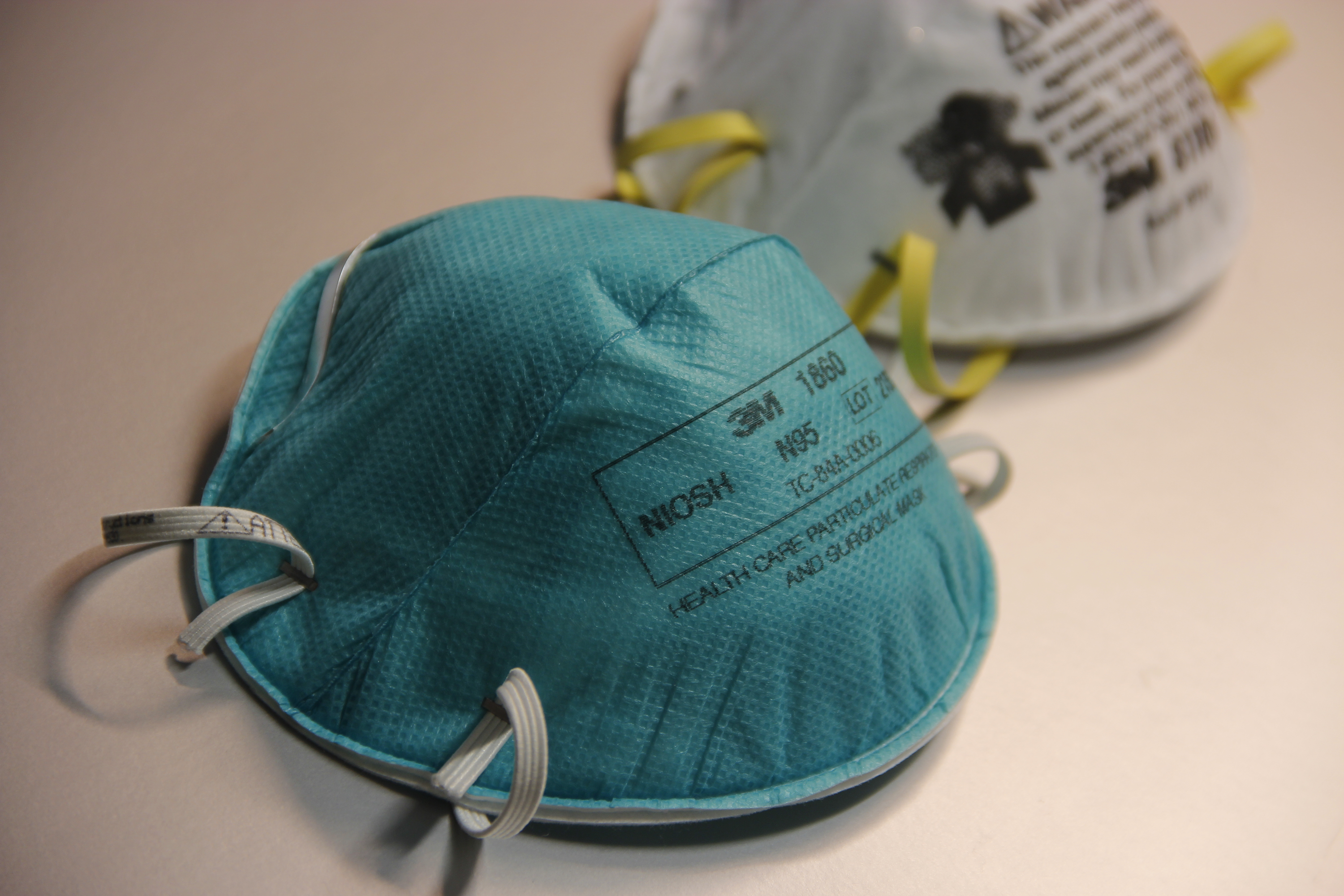 An N95 respirator forms a tight seal around the nose and mouth, protecting the wearer by filtering out at least 95% of infectious microscopic airborne particles.