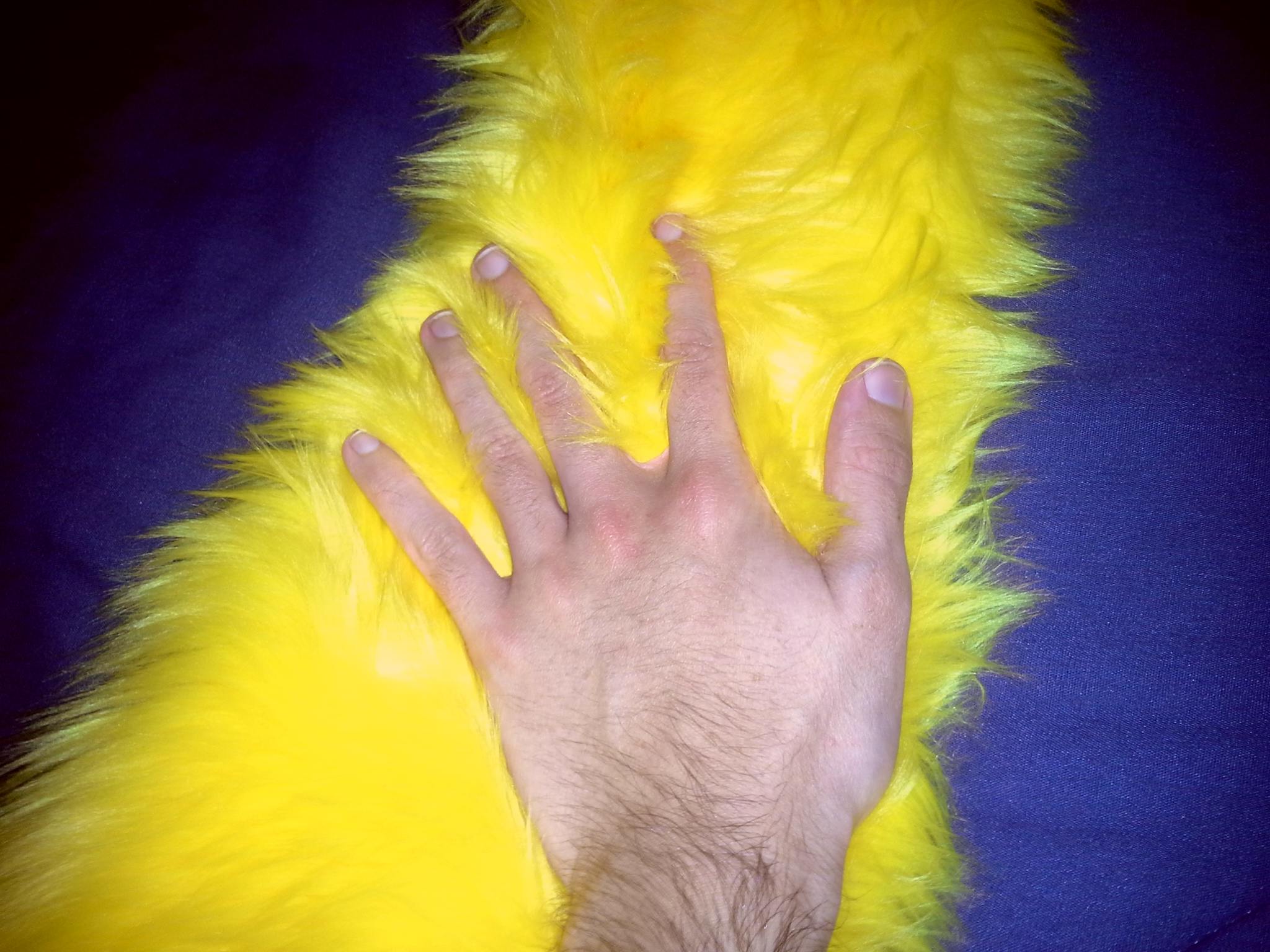 Tactile stimming, such as rubbing specific textures, provides predictable sensory feedback that helps some individuals with autism regulate their response to overwhelming environmental stimuli.