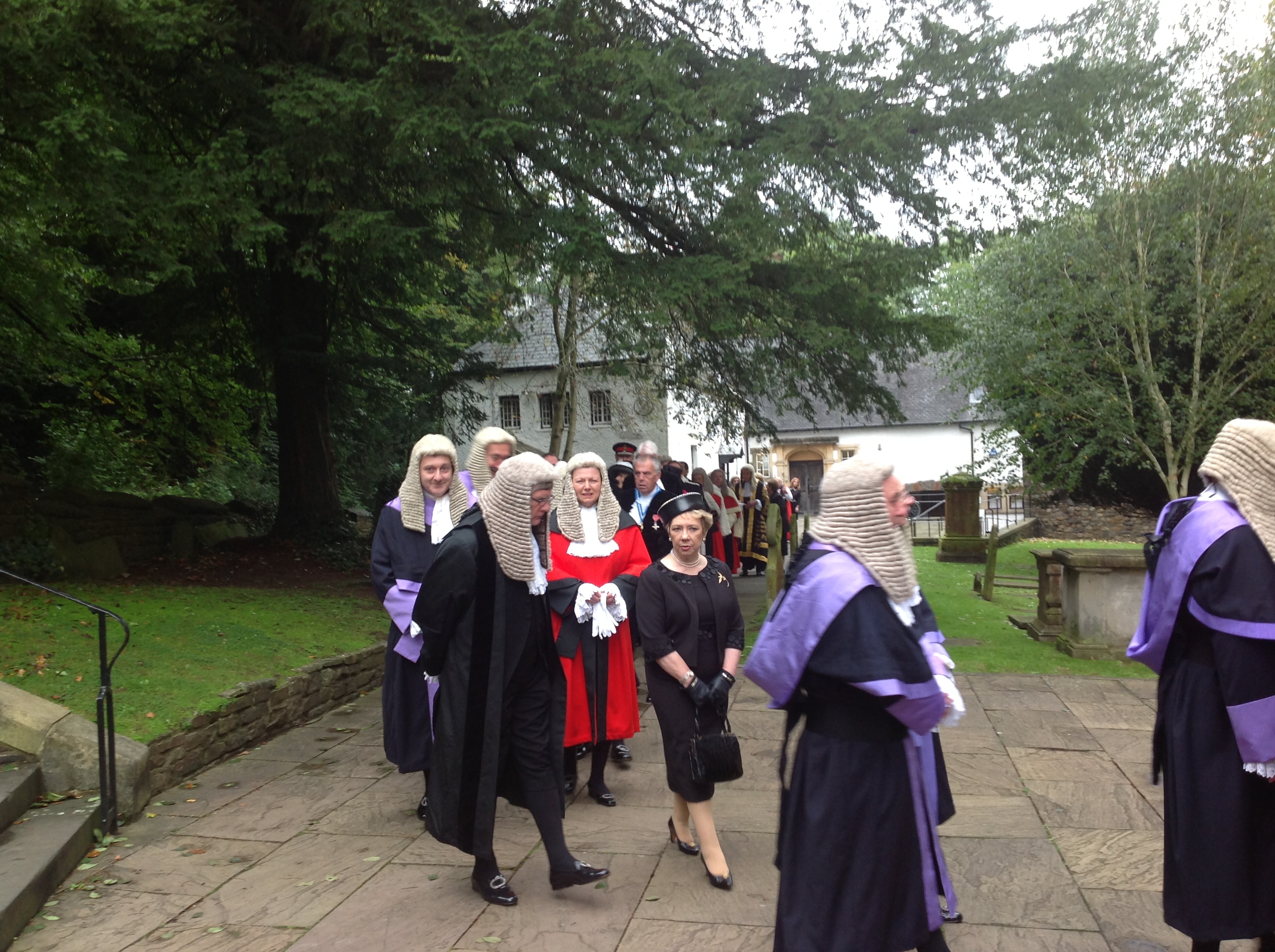 A Recorder in ceremonial robes alongside circuit judges — Recorders are part-time judges who continue practising as barristers or solicitors.
