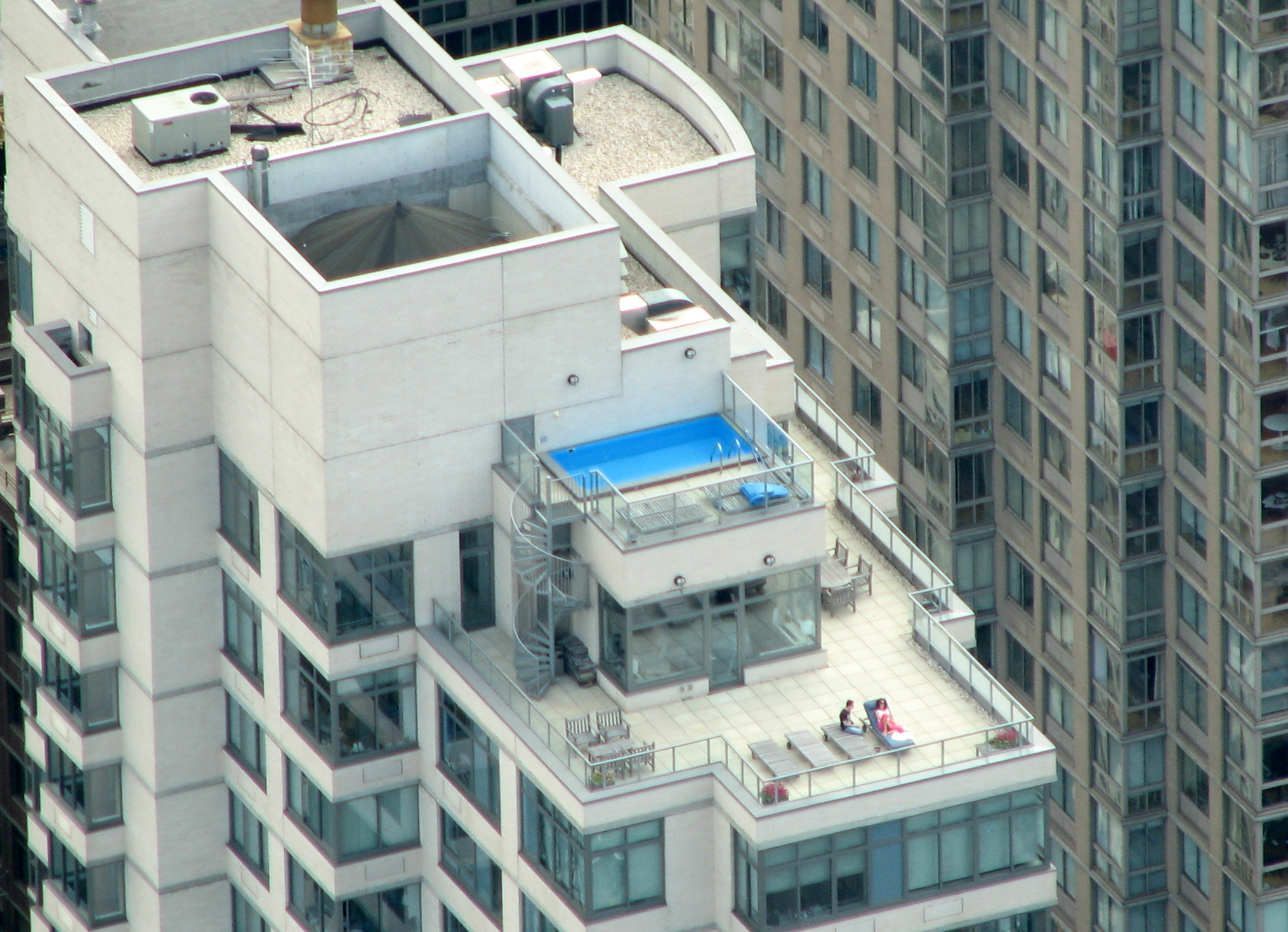 A luxury Manhattan penthouse. Shares in a cooperative are allocated proportionally; a penthouse with premium amenities will carry significantly more shares—and a proportionally higher monthly maintenance fee—than a standard lower-floor unit.