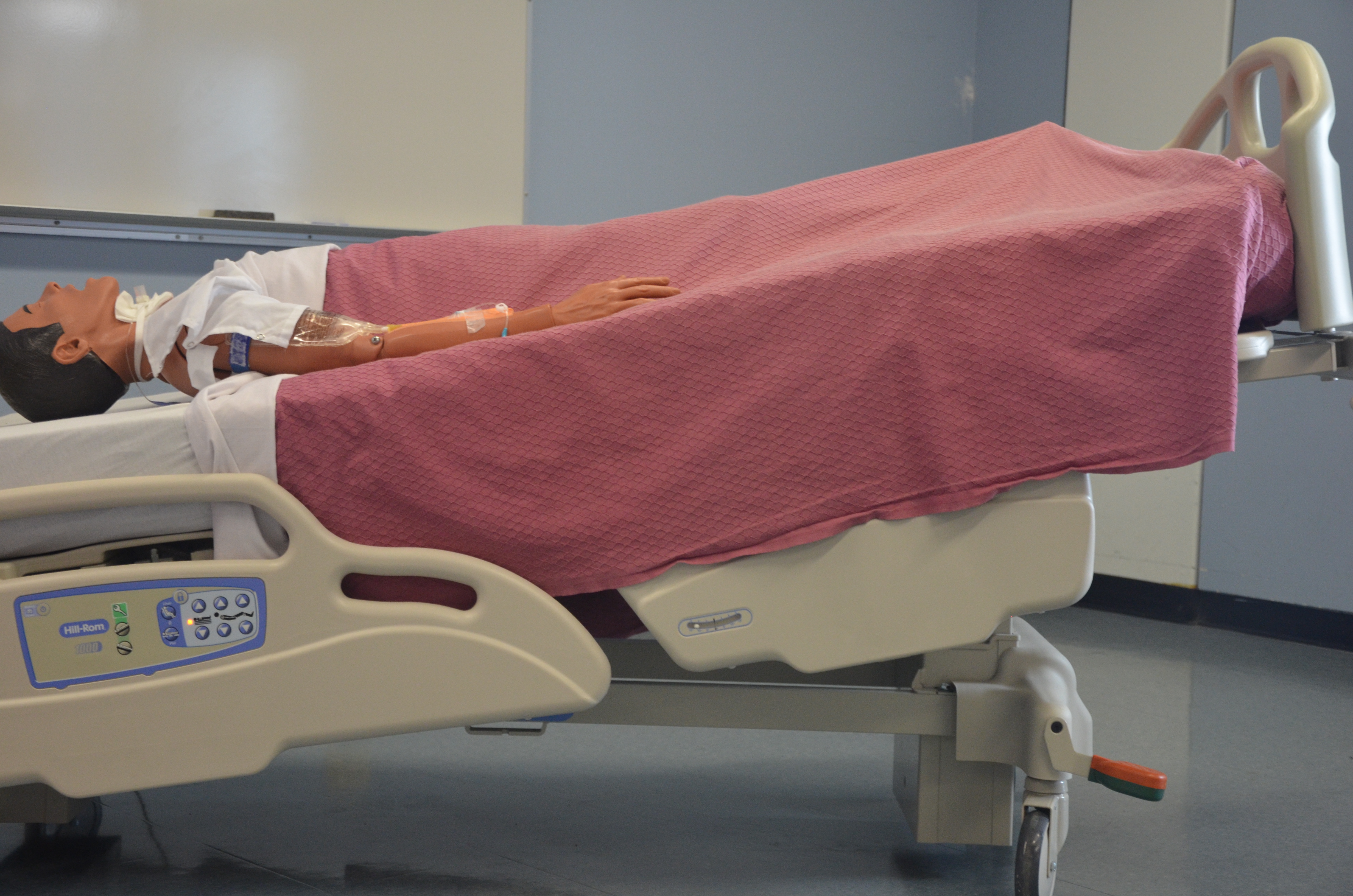 The Trendelenburg position (head lowered) combined with a left lateral tilt uses gravity to trap a life-threatening air embolism in the right ventricle, preventing it from blocking pulmonary blood flow.