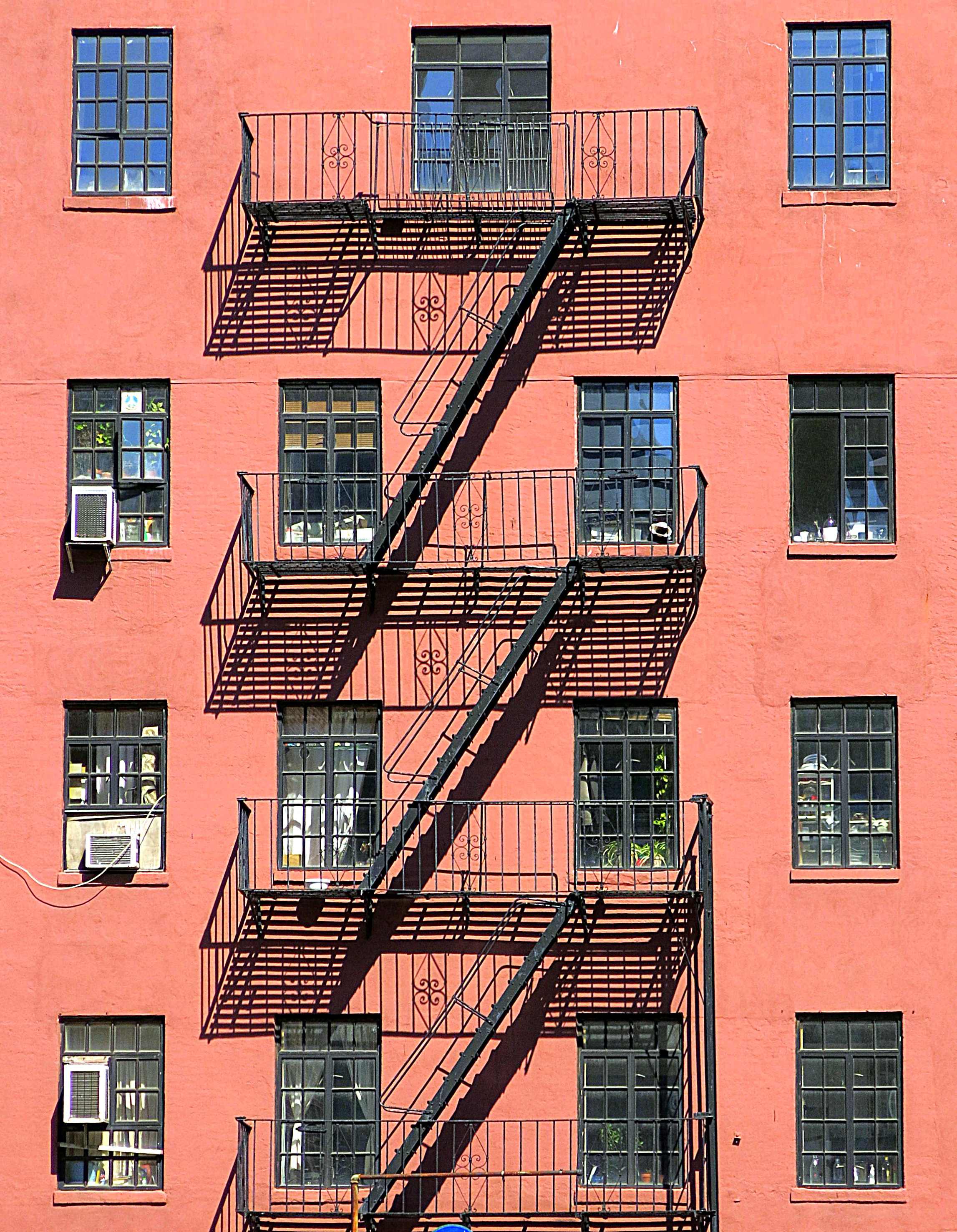 A fire escape on a New York building — blocking tenant access to one is the textbook example of a landlord breaching the quiet enjoyment covenant.