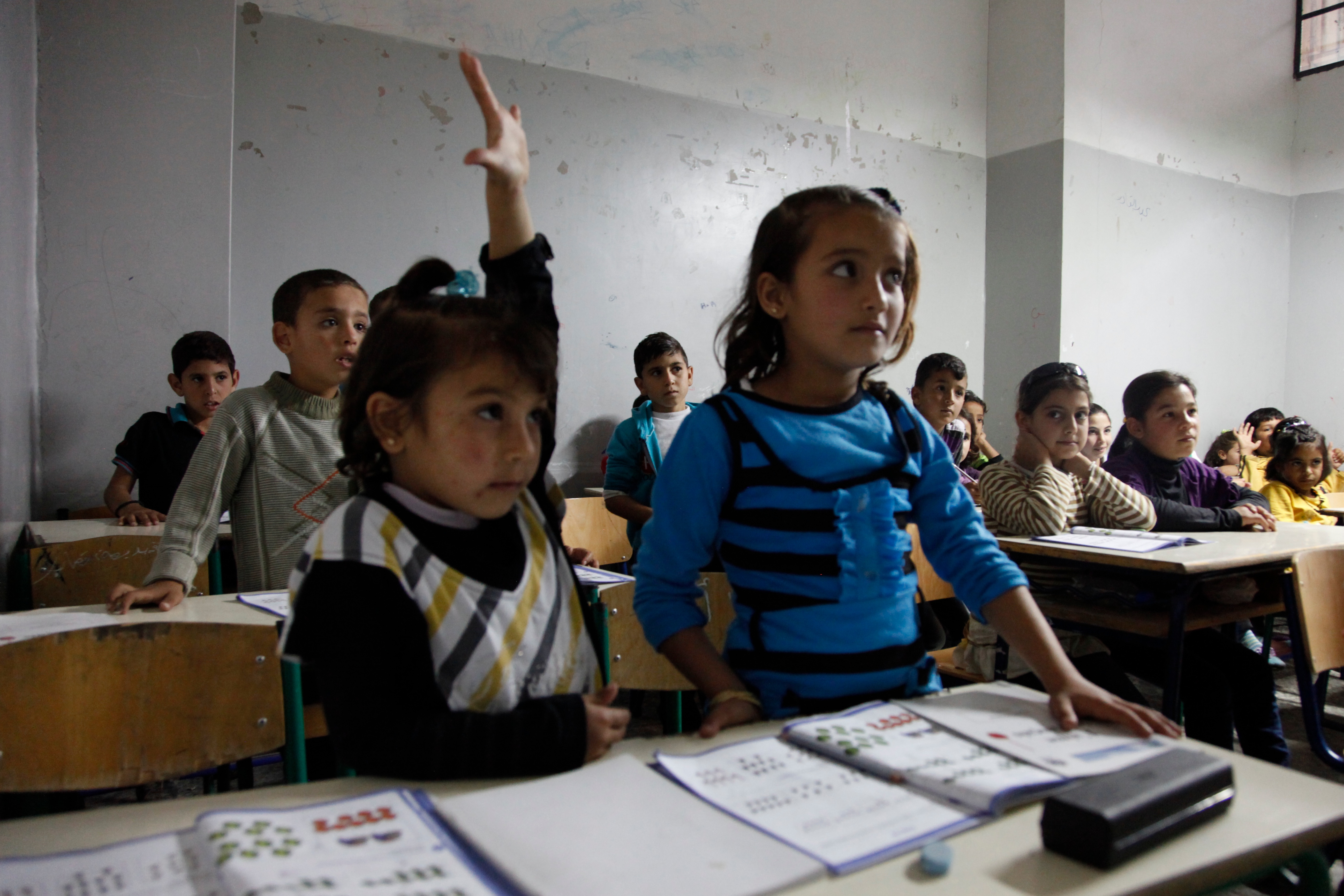 Explicitly teaching and reinforcing positive routines—such as raising a hand to speak rather than calling out—forms the foundation of Tier 1 behavioral management.