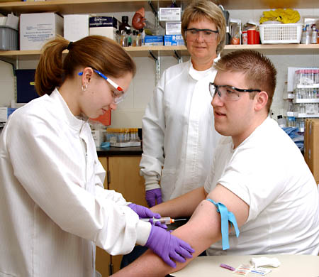 An elastic tourniquet distends veins for venipuncture but must not be left on longer than 1 minute to prevent inaccurate data from hemoconcentration.